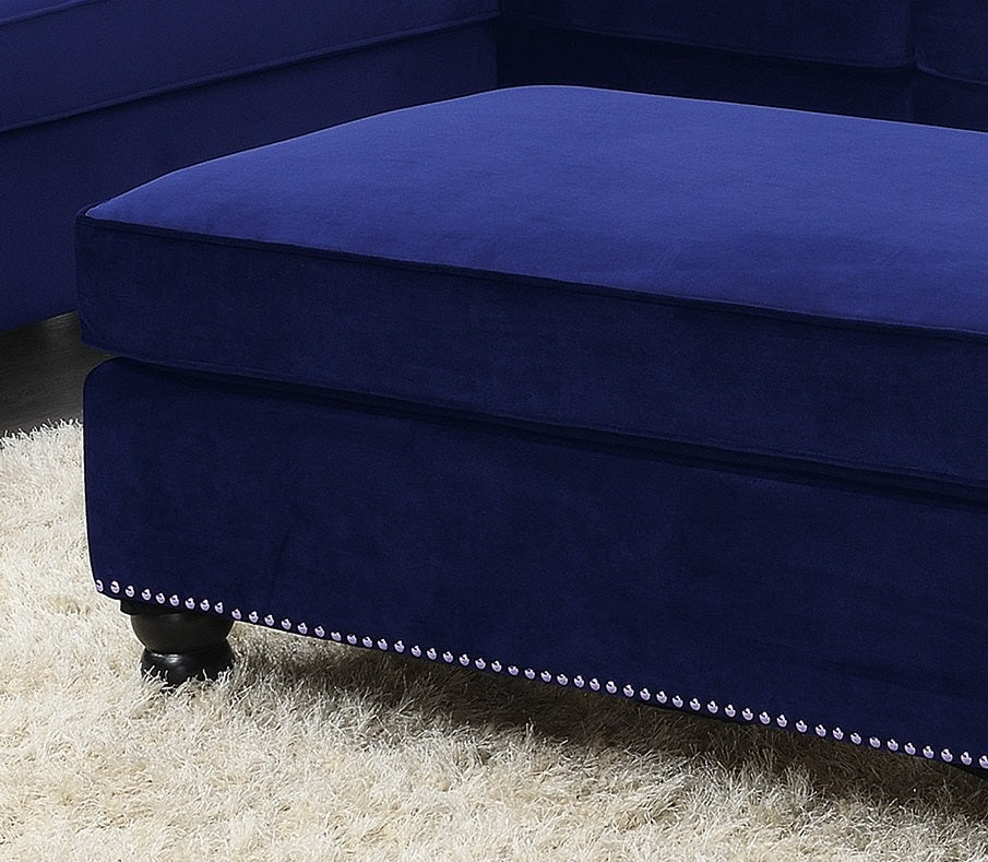 Navy velvet sofa ottoman with tufted design and studded base