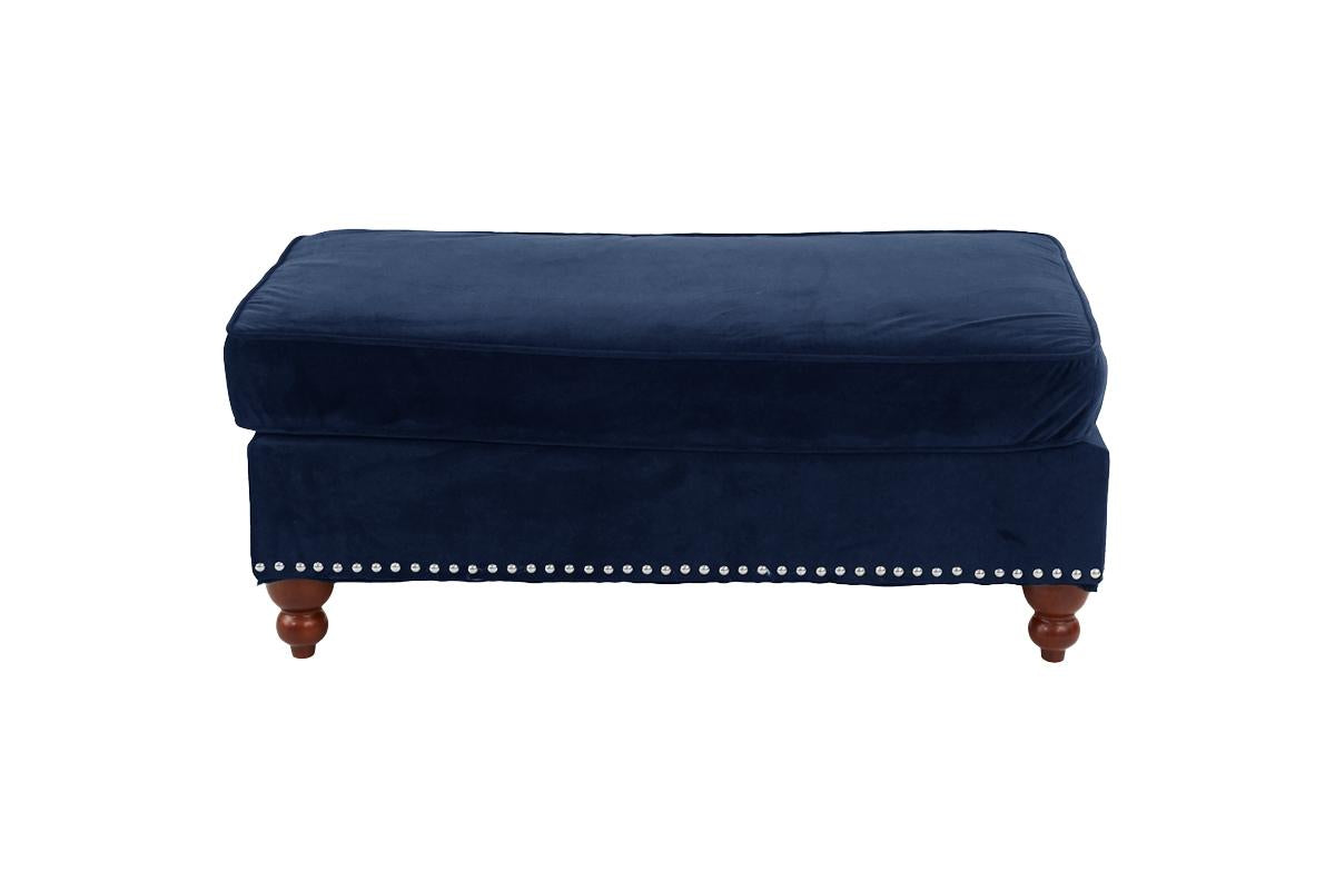 Navy blue velvet ottoman with studded trim and turned wooden legs