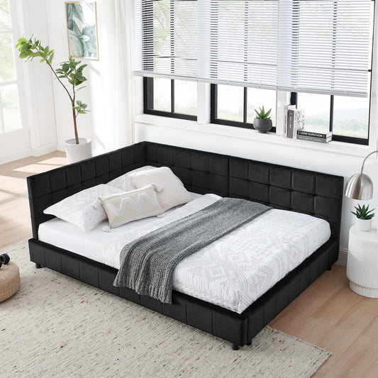 Plush black velvet sectional bed frame with upholstered headboard and white bedding