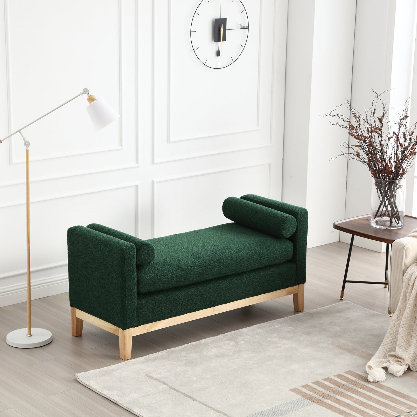 Dark green boucle upholstered bench with rolled armrests and wooden legs