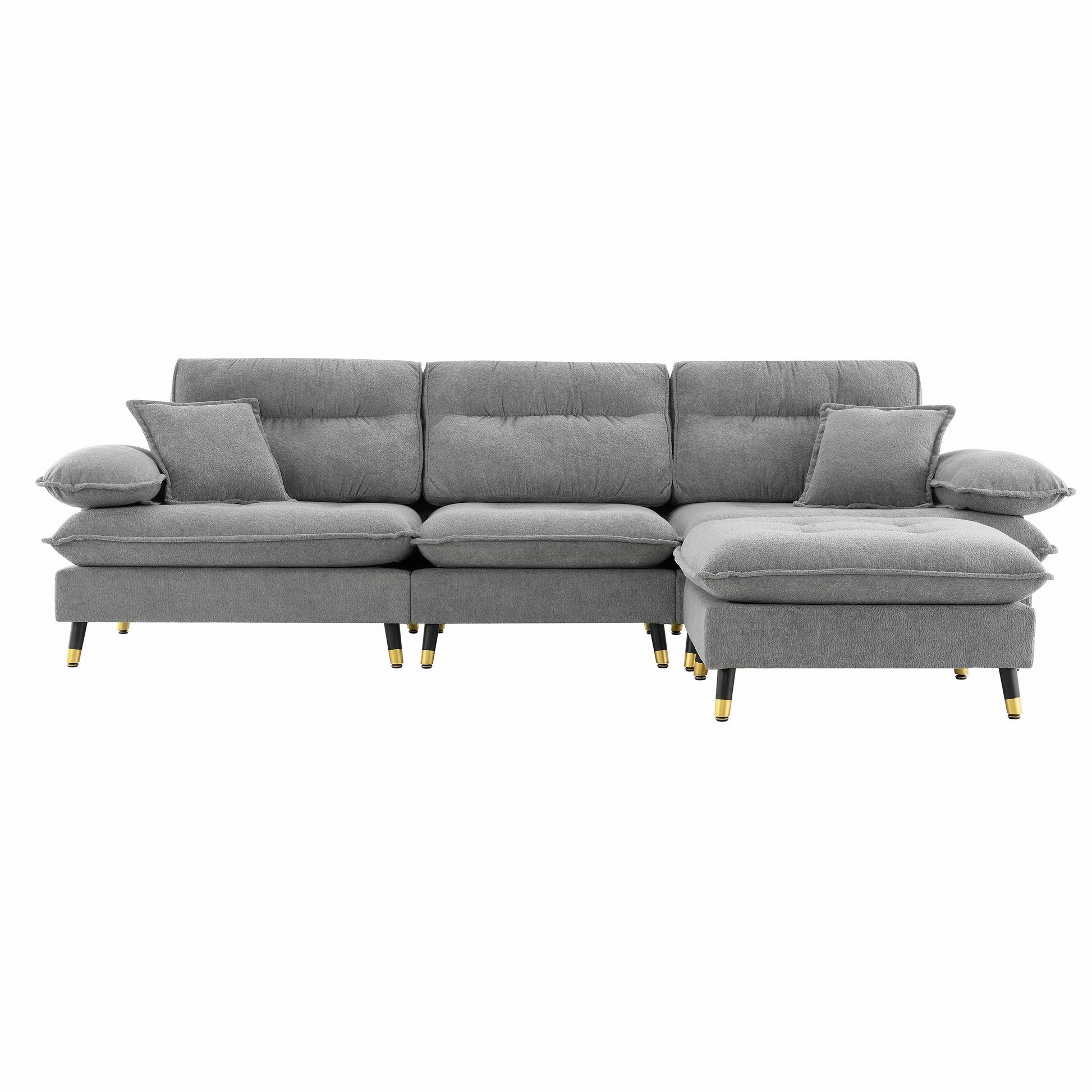 Plush grey sectional sofa with tufted cushions and modern goldtipped legs