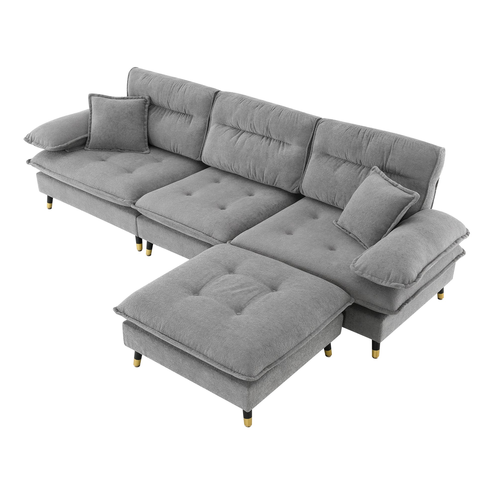 Gray fabric sectional sofa with tufted cushions and goldtipped legs perfect for living room seating
