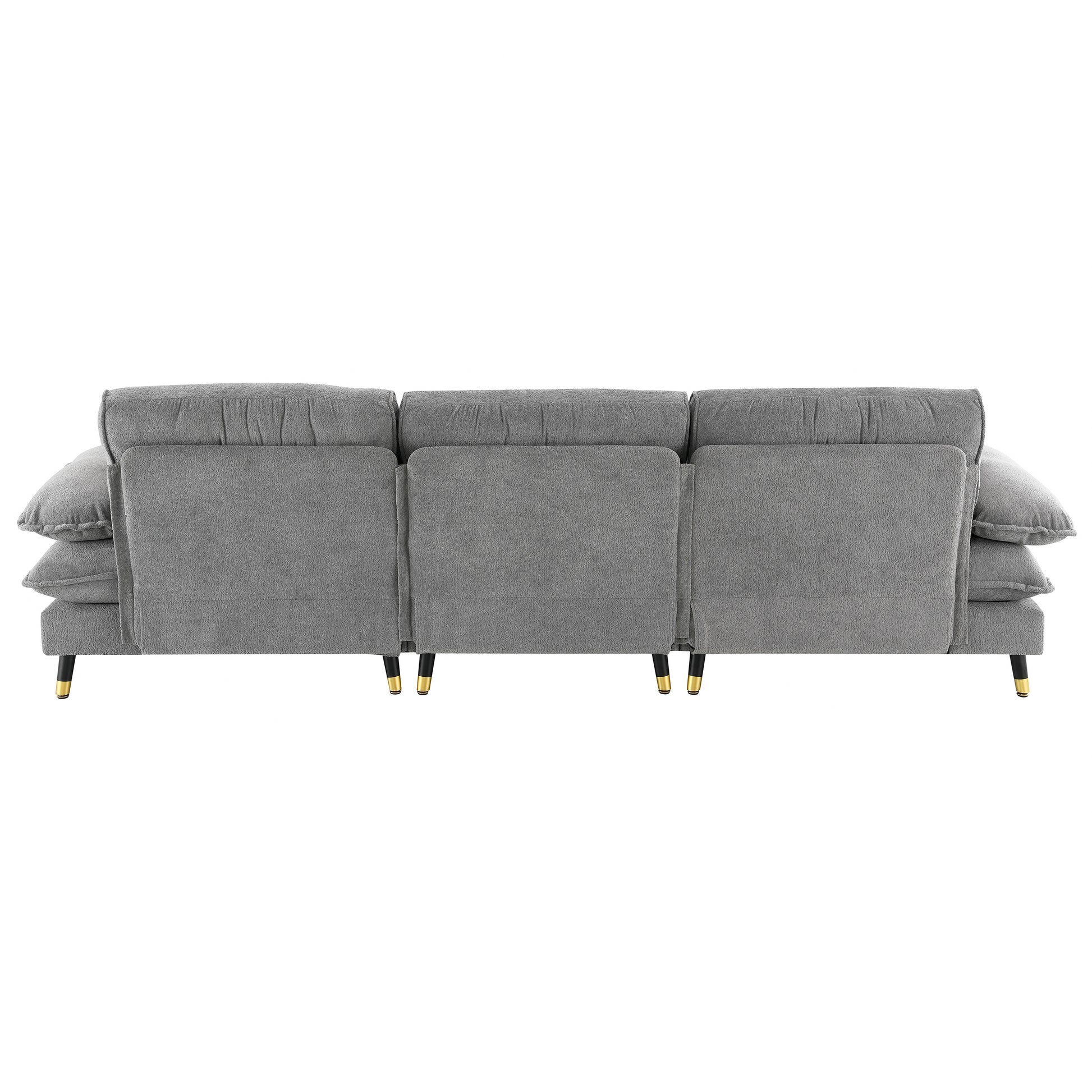 Plush gray threeseater sofa with tufted back cushions and goldtipped black legs