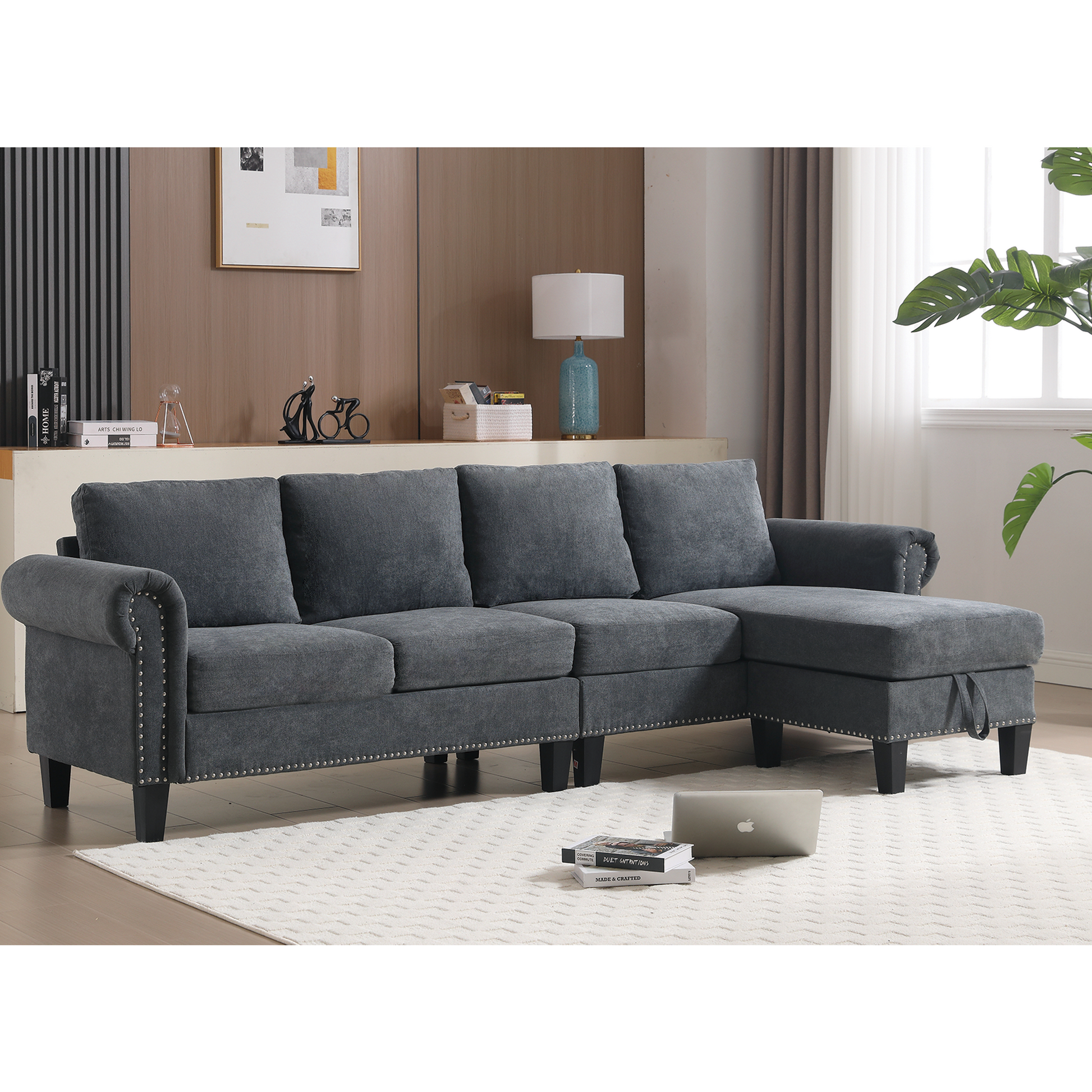 Dark grey fabric sectional sofa with studded trim and chaise lounge for living room comfort