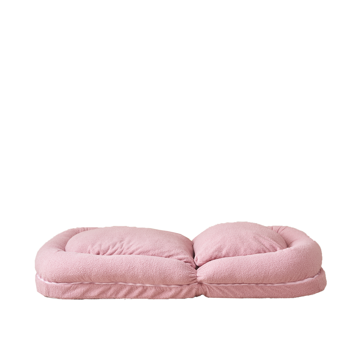 Plush pink dog bed with raised bolster for comfortable pet sleeping