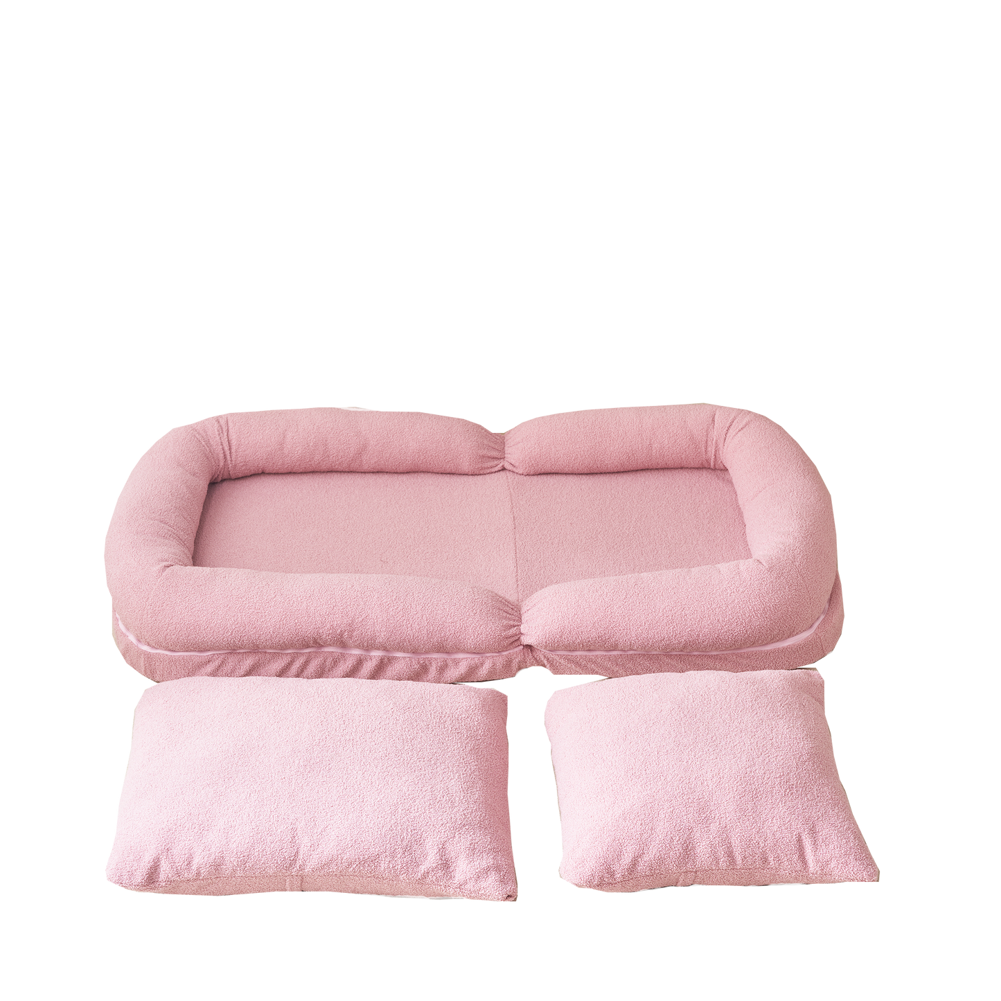 Plush pink dog bed with bolster and separate cushions for ultimate pet comfort