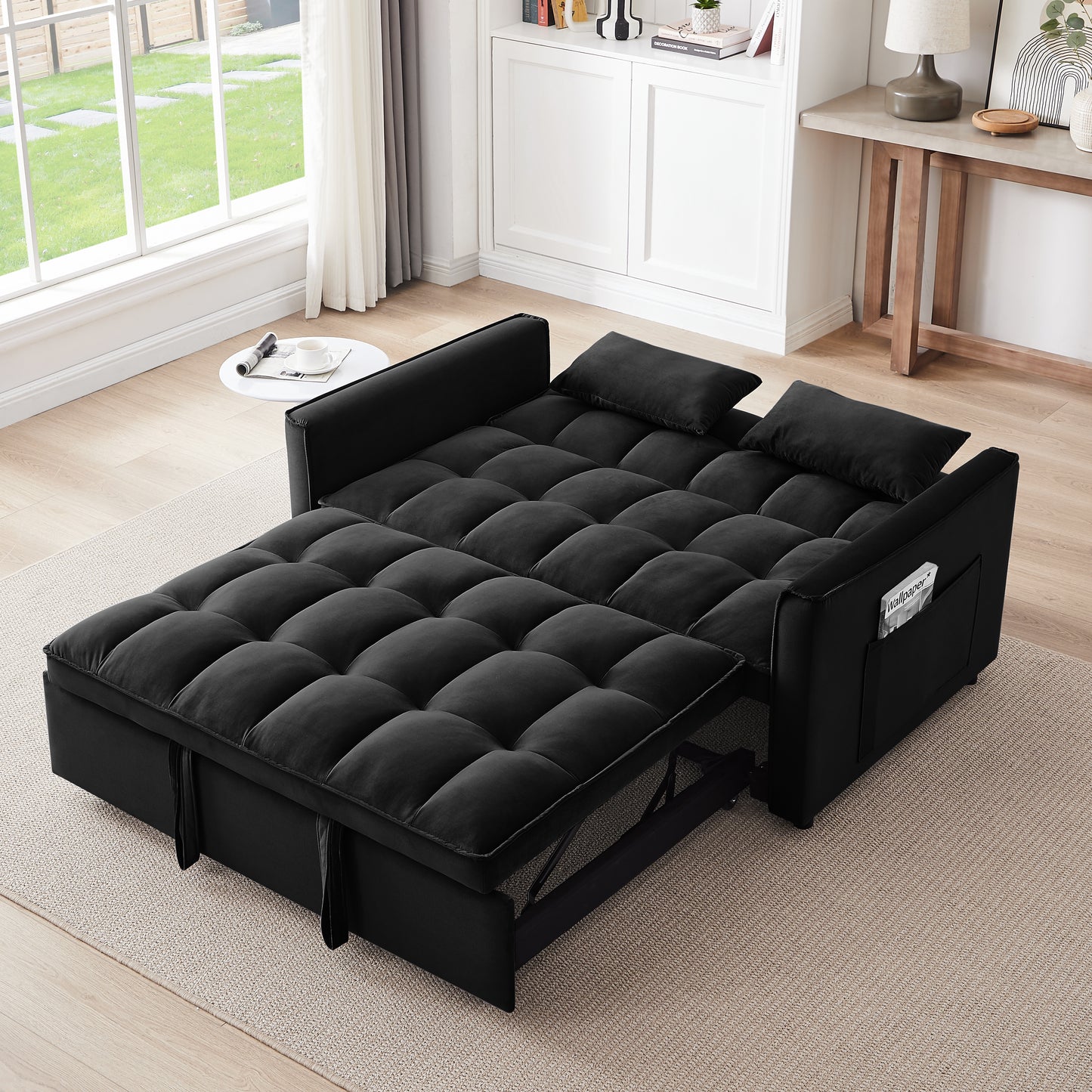 Black velvet sofa bed with tufted cushions and pullout mattress for versatile seating