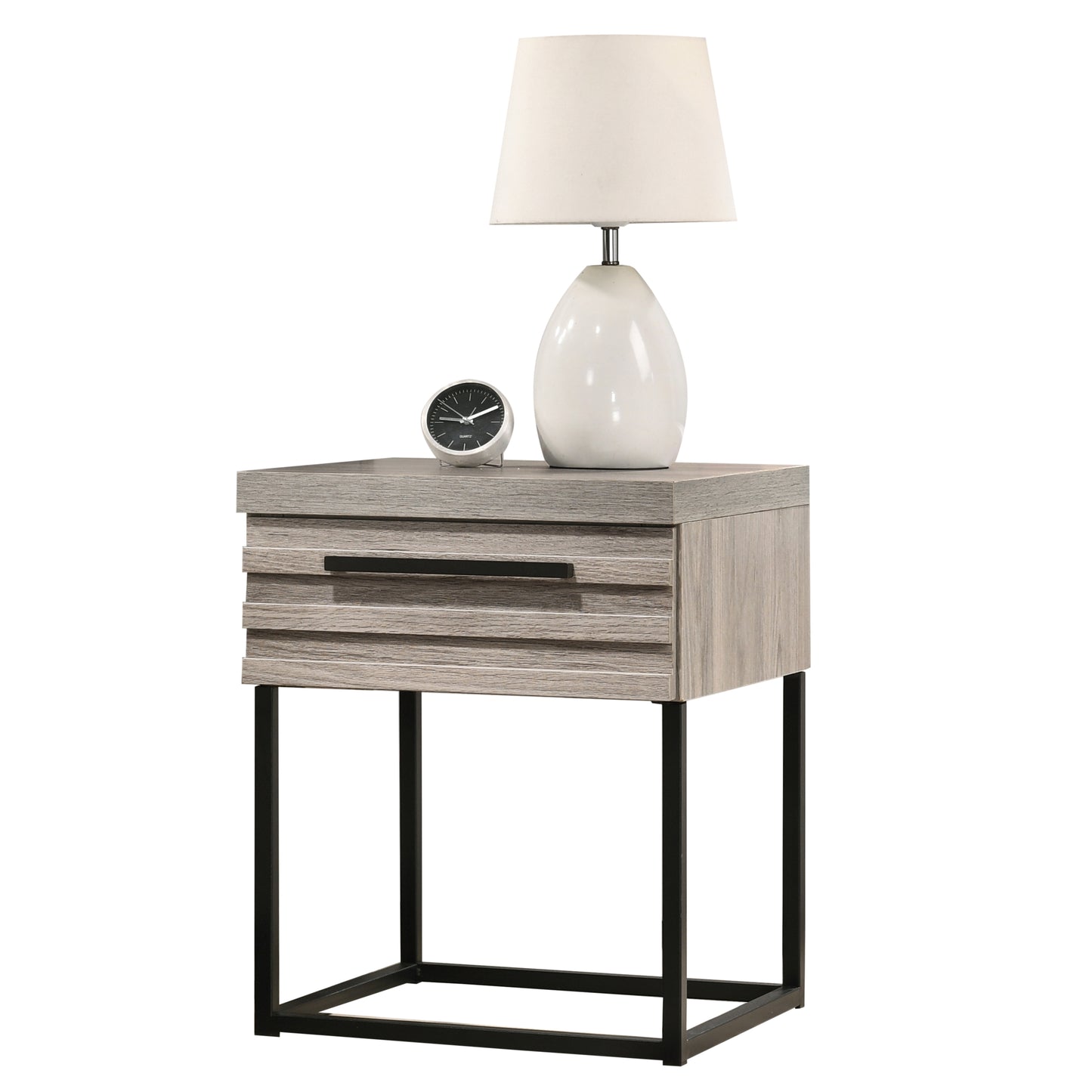 Modern gray wood bedside table with one drawer a white ceramic lamp and a silver clock