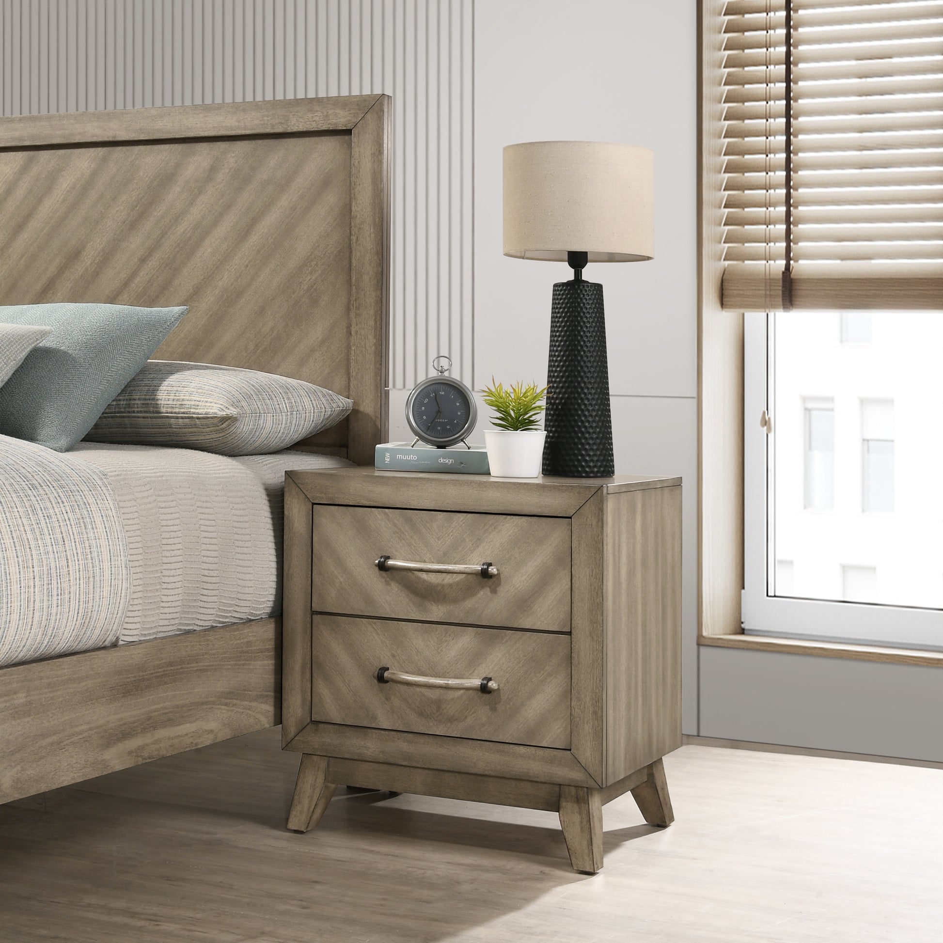 Twodrawer distressed wood nightstand with ropestyle pulls beside a bed