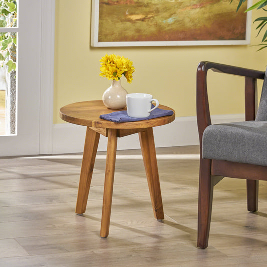 Round acacia wood side table with angled legs perfect for small living spaces