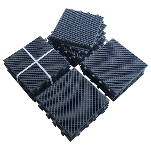 Black interlocking garage floor tiles in stacked bundles