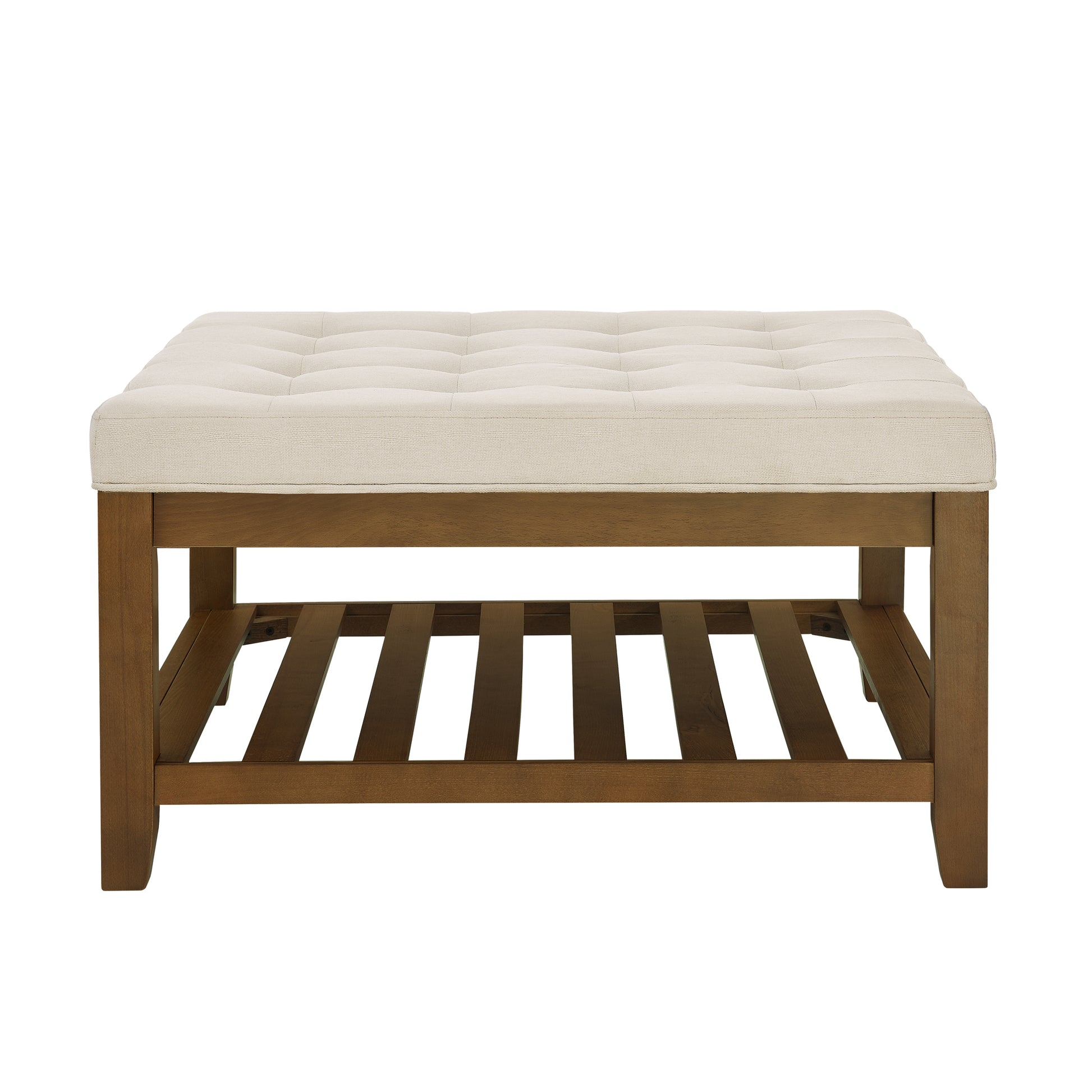 Tufted cream fabric upholstered ottoman bench with a dark wood slatted shelf below
