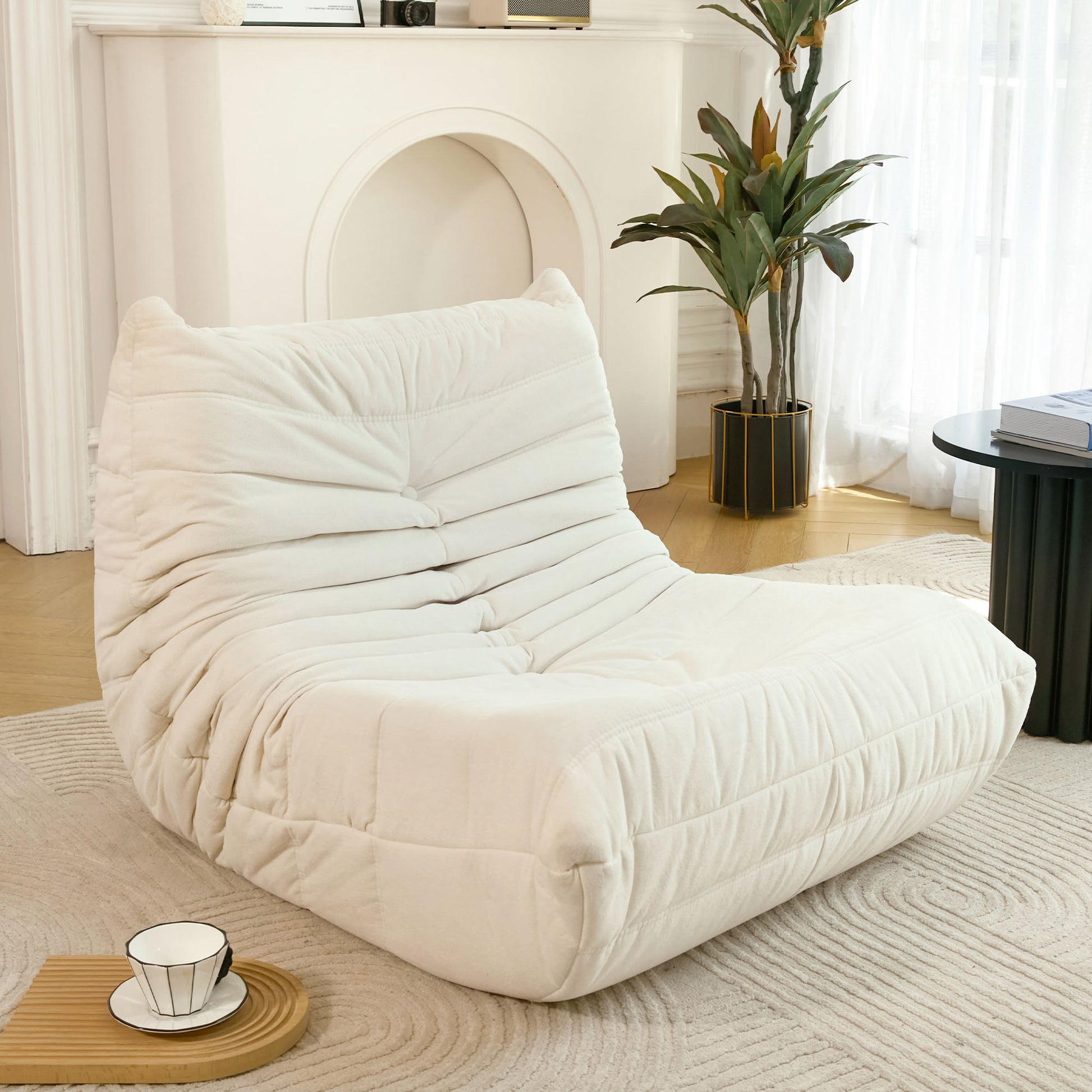 Cream plush floor sofa with horizontal tufting a modern accent for living rooms