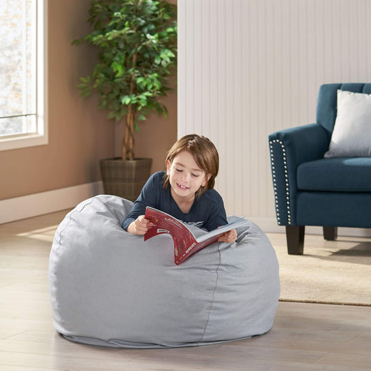 Gray fabric bean bag chair with a boy reading comfortably