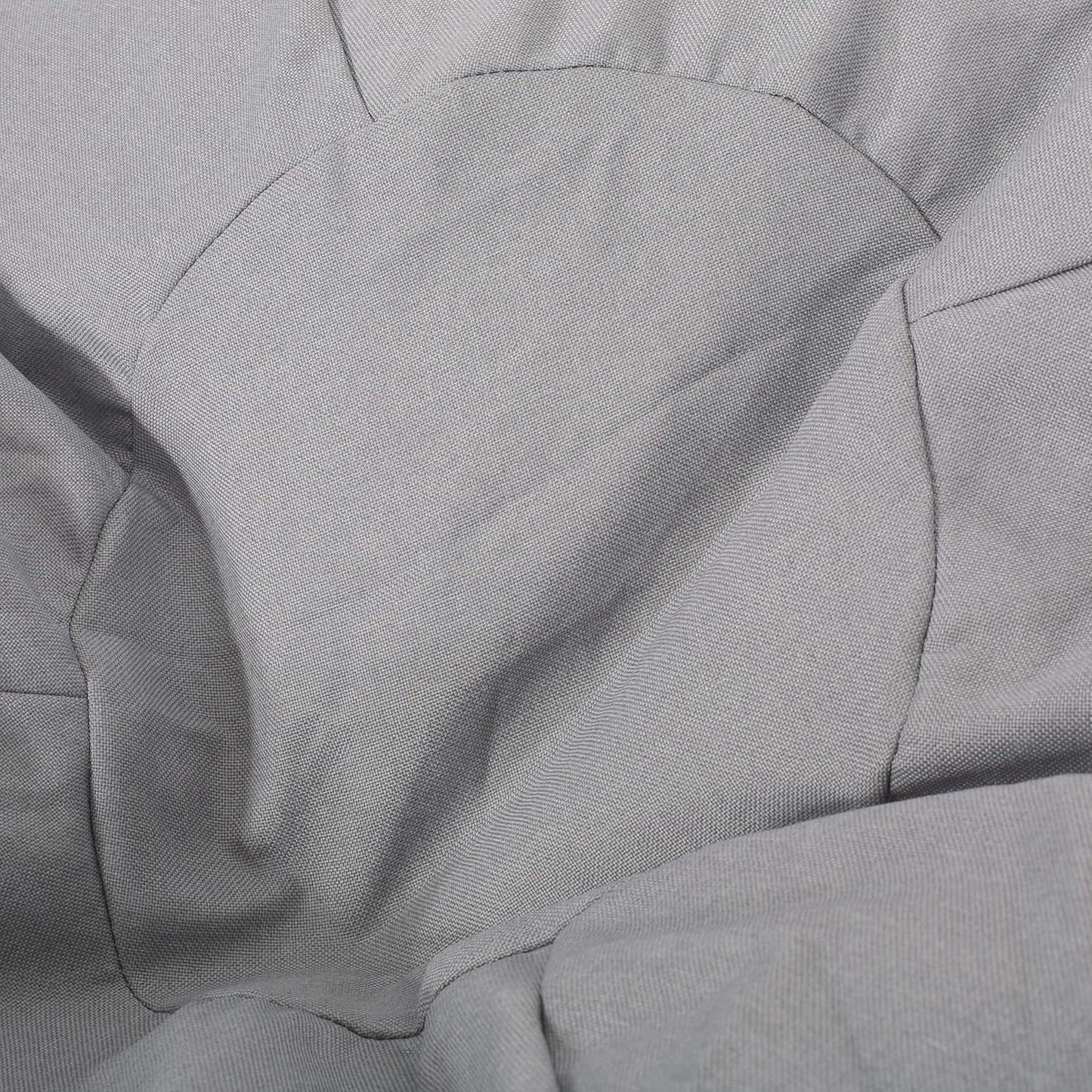Closeup of textured grey fabric with subtle stitching detail perfect for a modern armchair upholstery