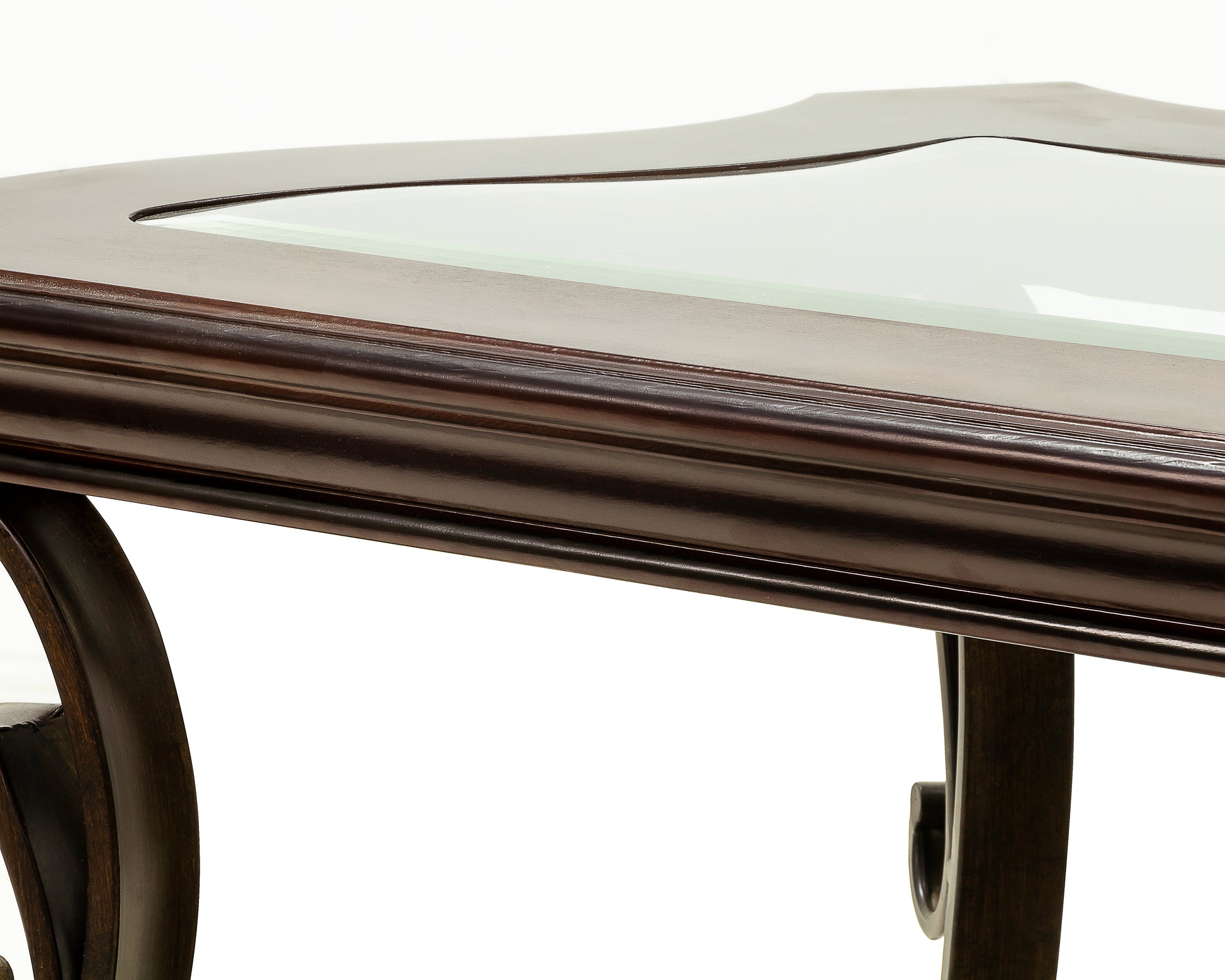 Rich mahogany coffee table with glass inlay and carved wooden legs