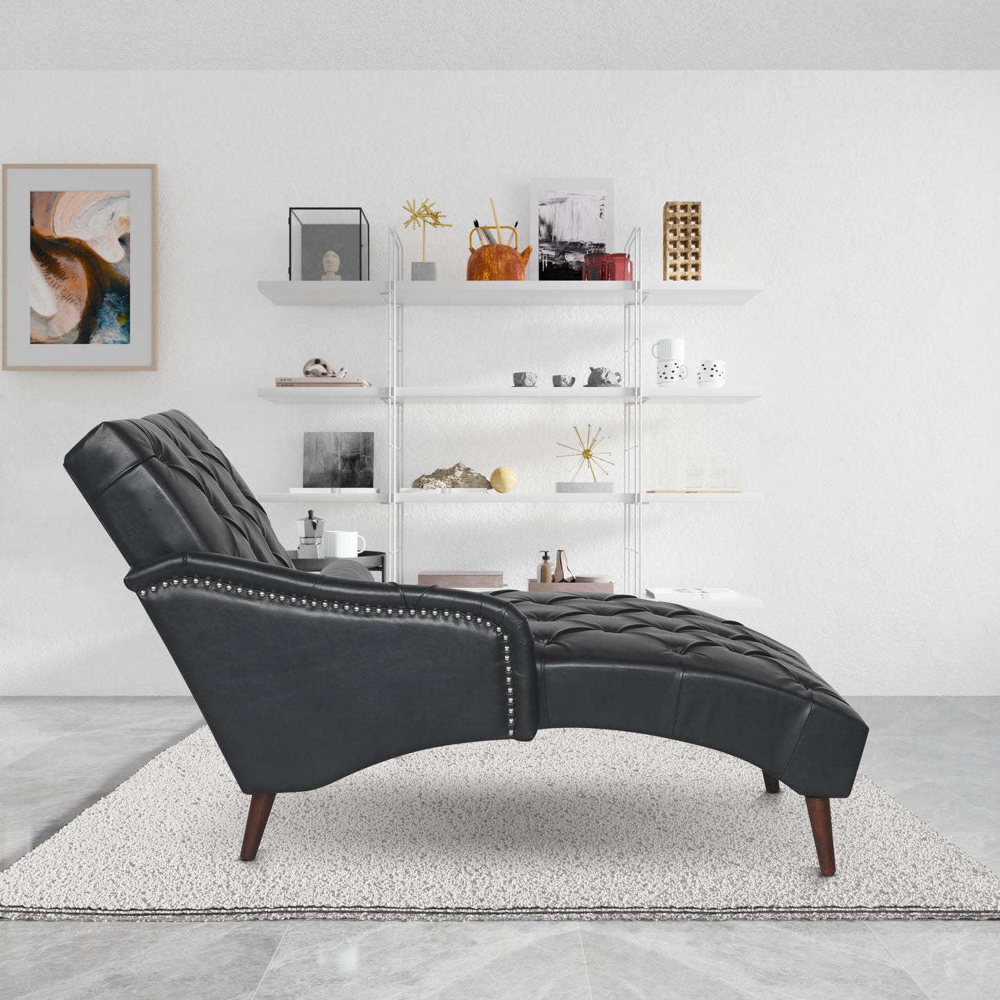 Black tufted chaise lounge with silver nailhead trim and dark wood legs