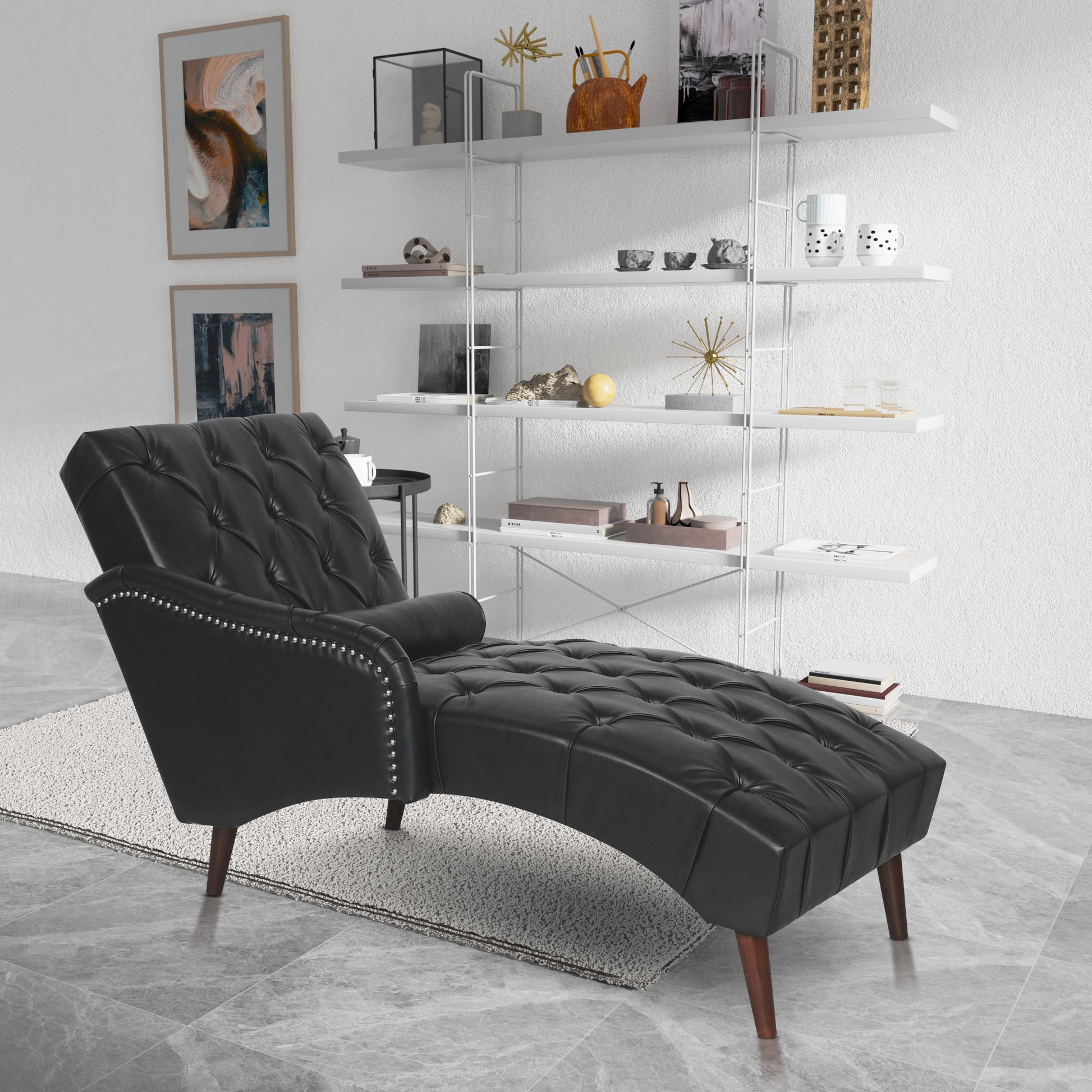 Black tufted chaise lounge with silver nailhead trim and dark wood legs perfect for a stylish living room