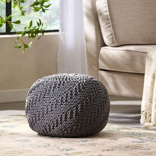 Chunky knit grey round ottoman with textured weave perfect for modern living rooms