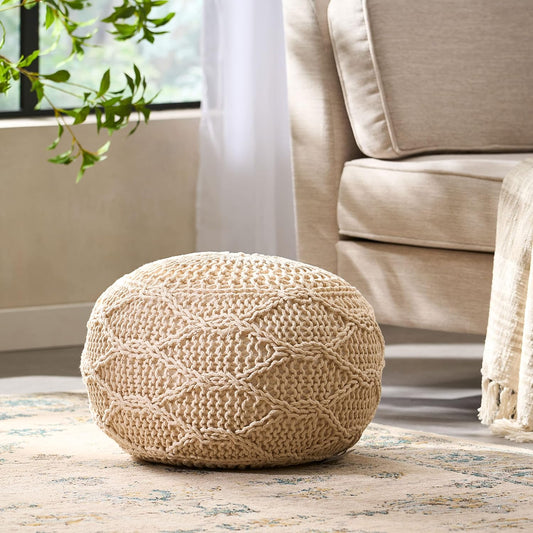 Cream knit pouf with diamond pattern perfect for accent seating
