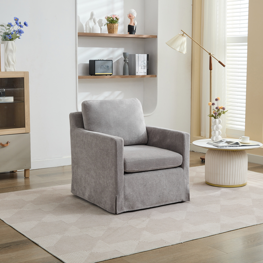 Plush grey fabric armchair with deep seat cushions and skirted base perfect for living rooms