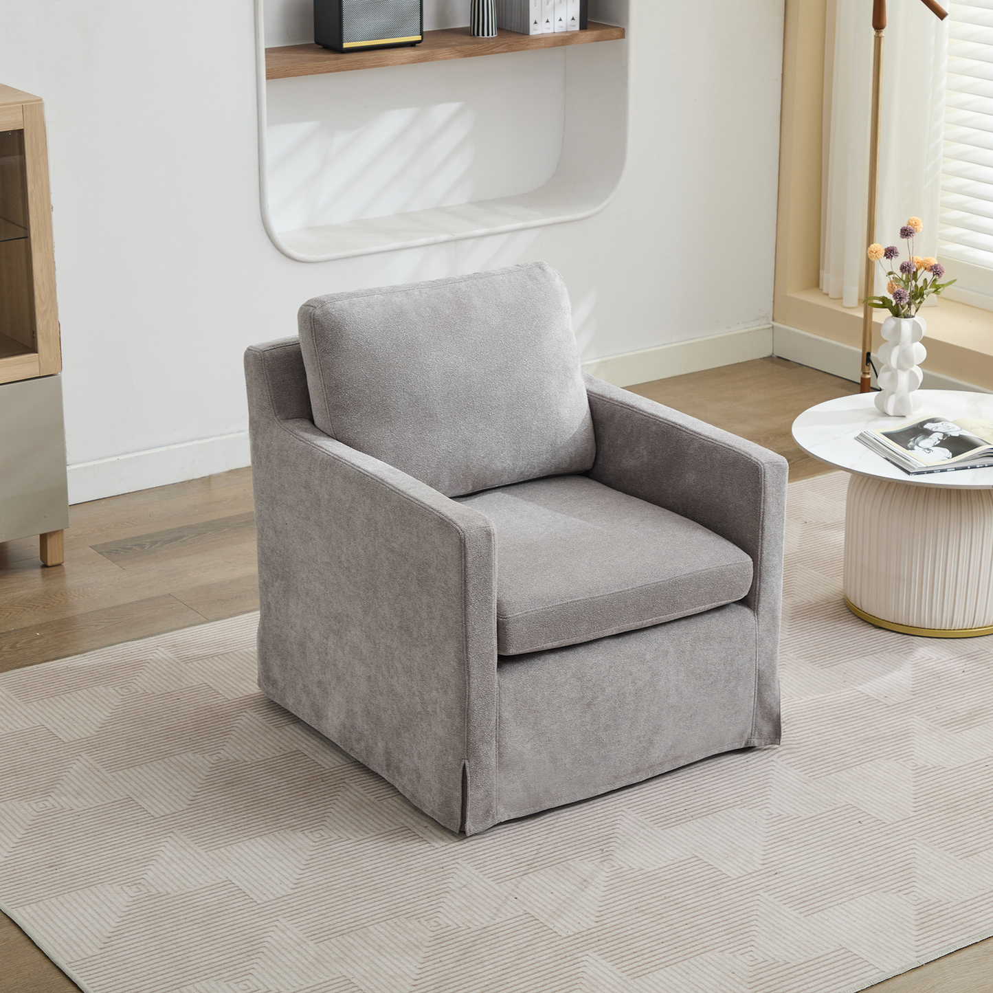 Plush grey fabric armchair with clean lines perfect for modern living rooms