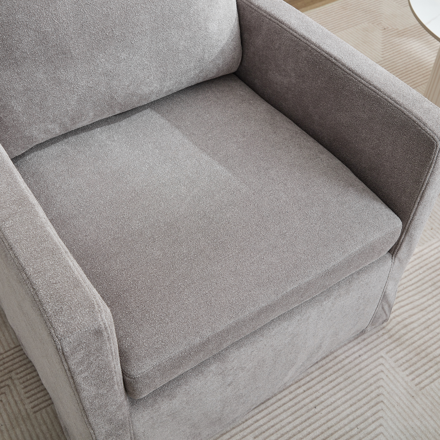 Plush gray fabric armchair with comfortable seating perfect for any modern living room