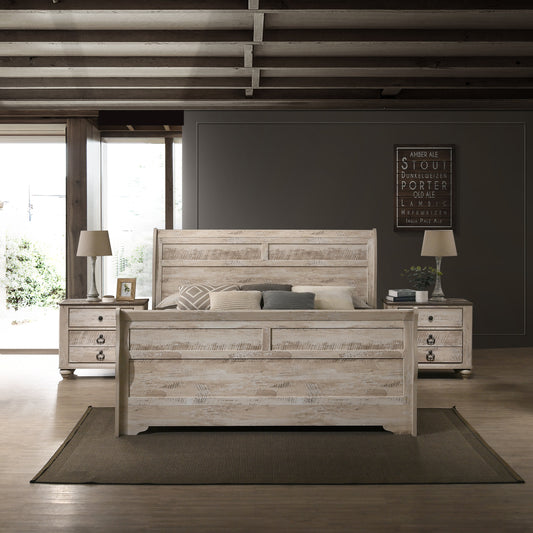 Rustic whitewashed wood king bed frame with stacked pillows and textured bedding