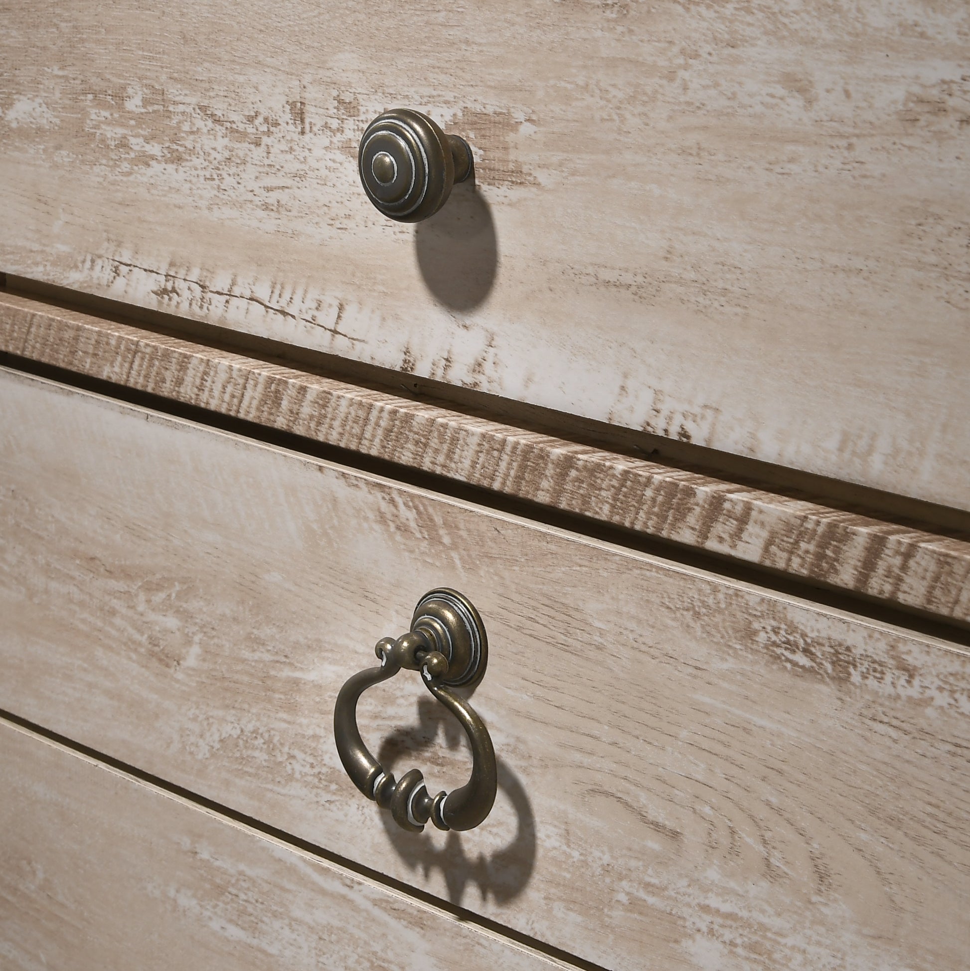 Light oak dresser drawers with antique brass knobs