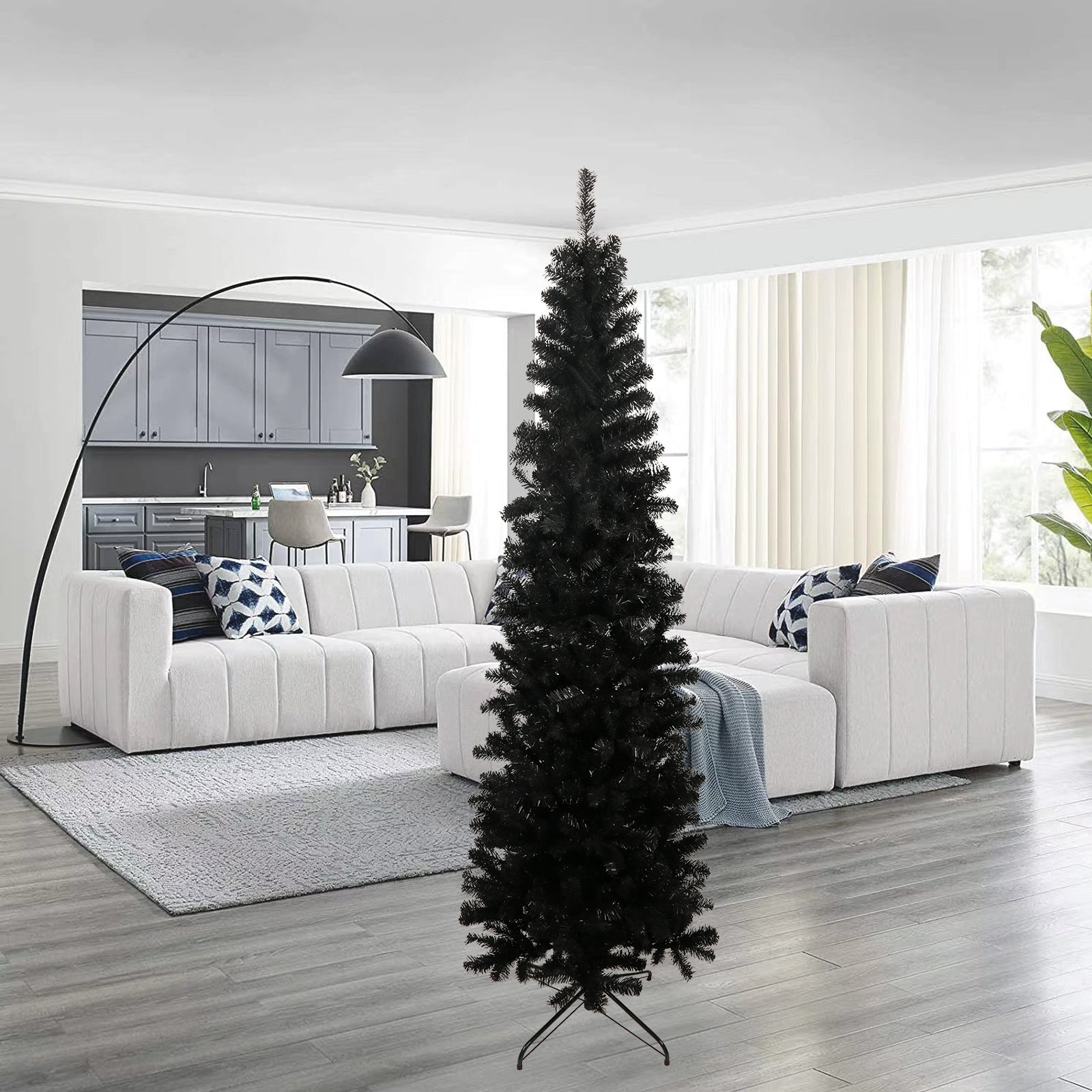 Tall artificial black Christmas tree with realistic branches perfect for modern decor