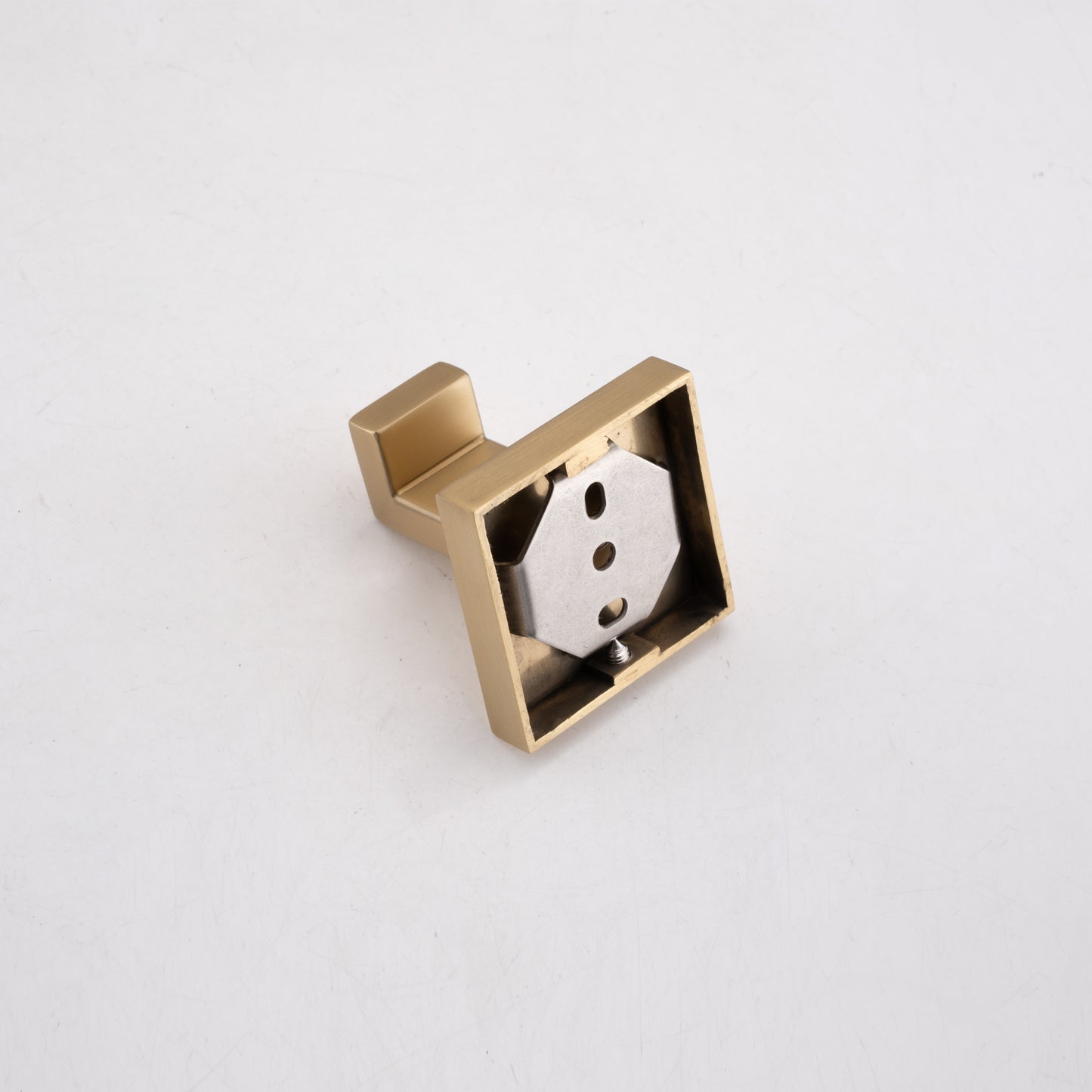 Brushed brass square toilet paper holder with modern angular design
