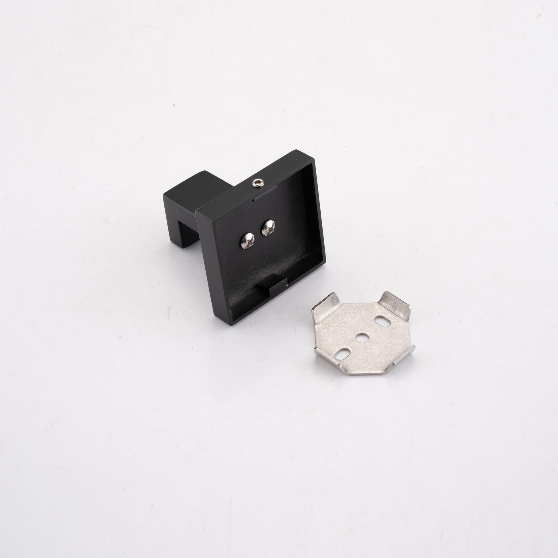 Black metal wall lamp bracket with mounting screws and a separate base plate