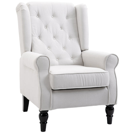 Elegant light gray tufted wingback chair with dark wooden legs perfect for a cozy reading nook