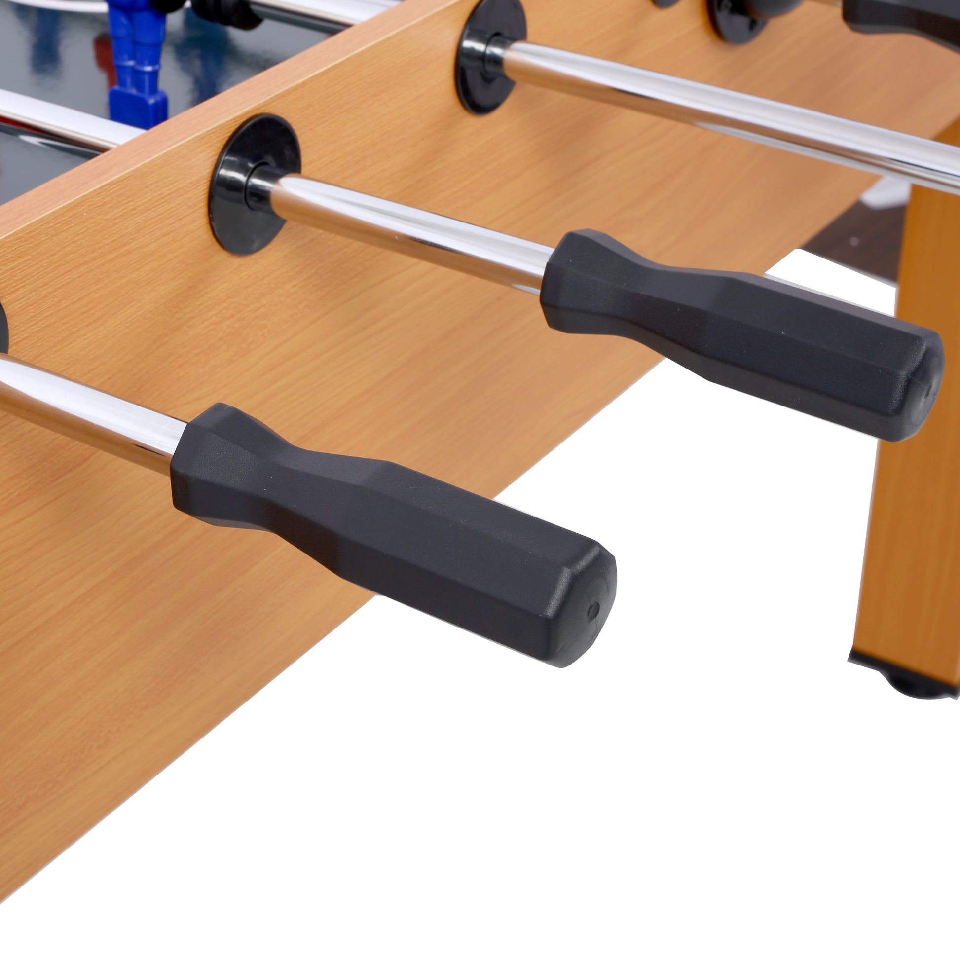 Closeup of black grips on chrome rods of a wooden foosball table