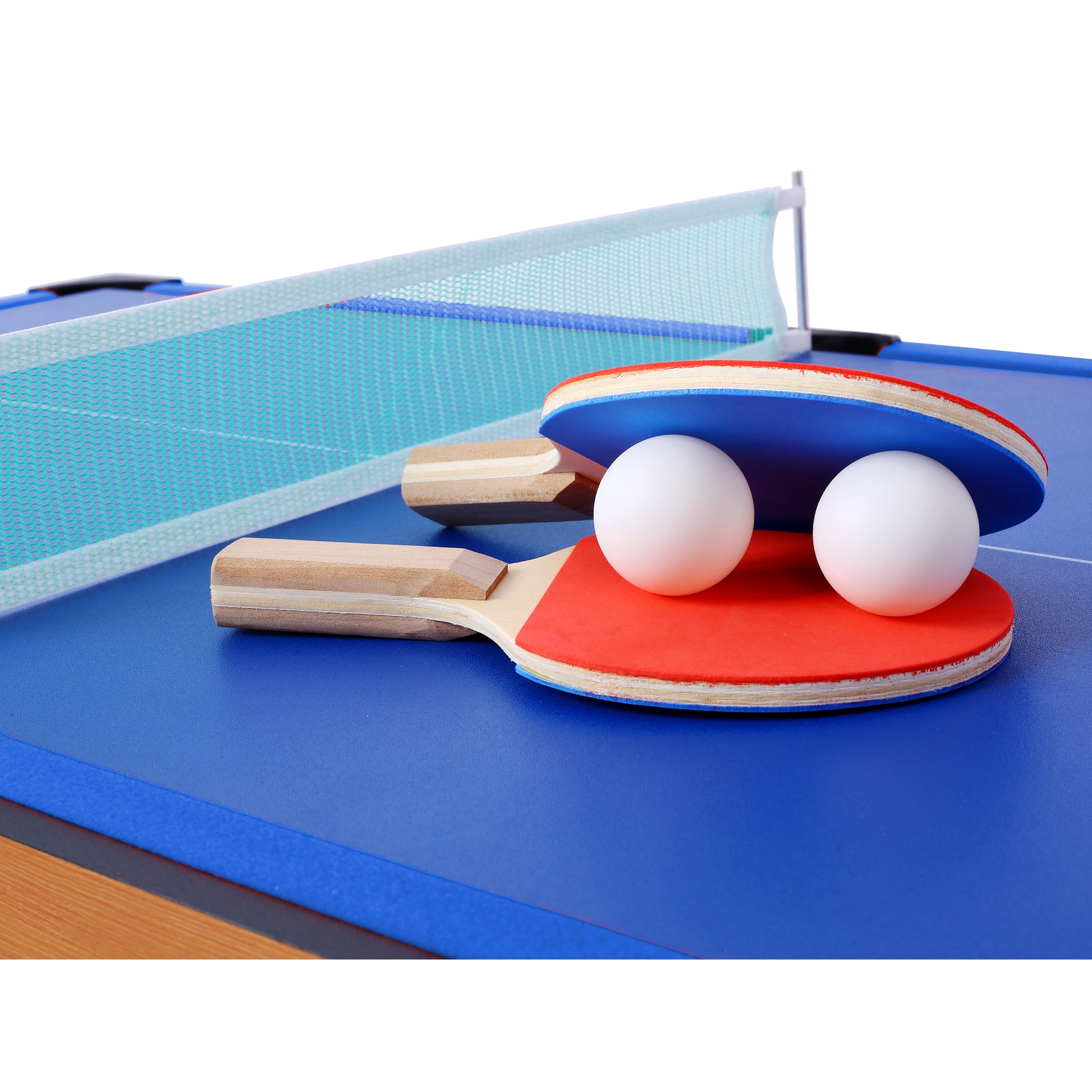 Two ping pong paddles and two balls on a blue table tennis table