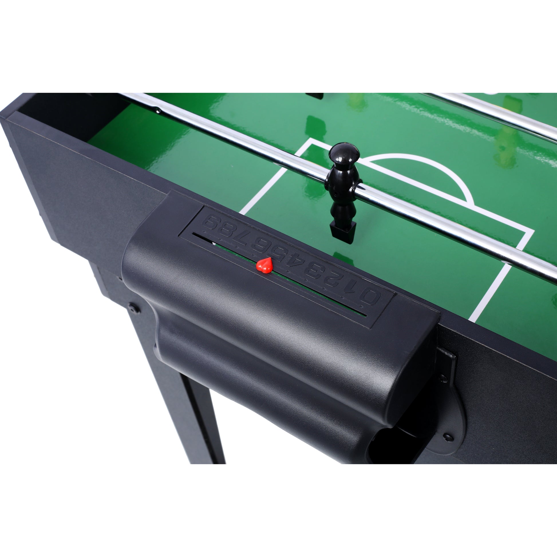 Black foosball table with green playing field and metal rods