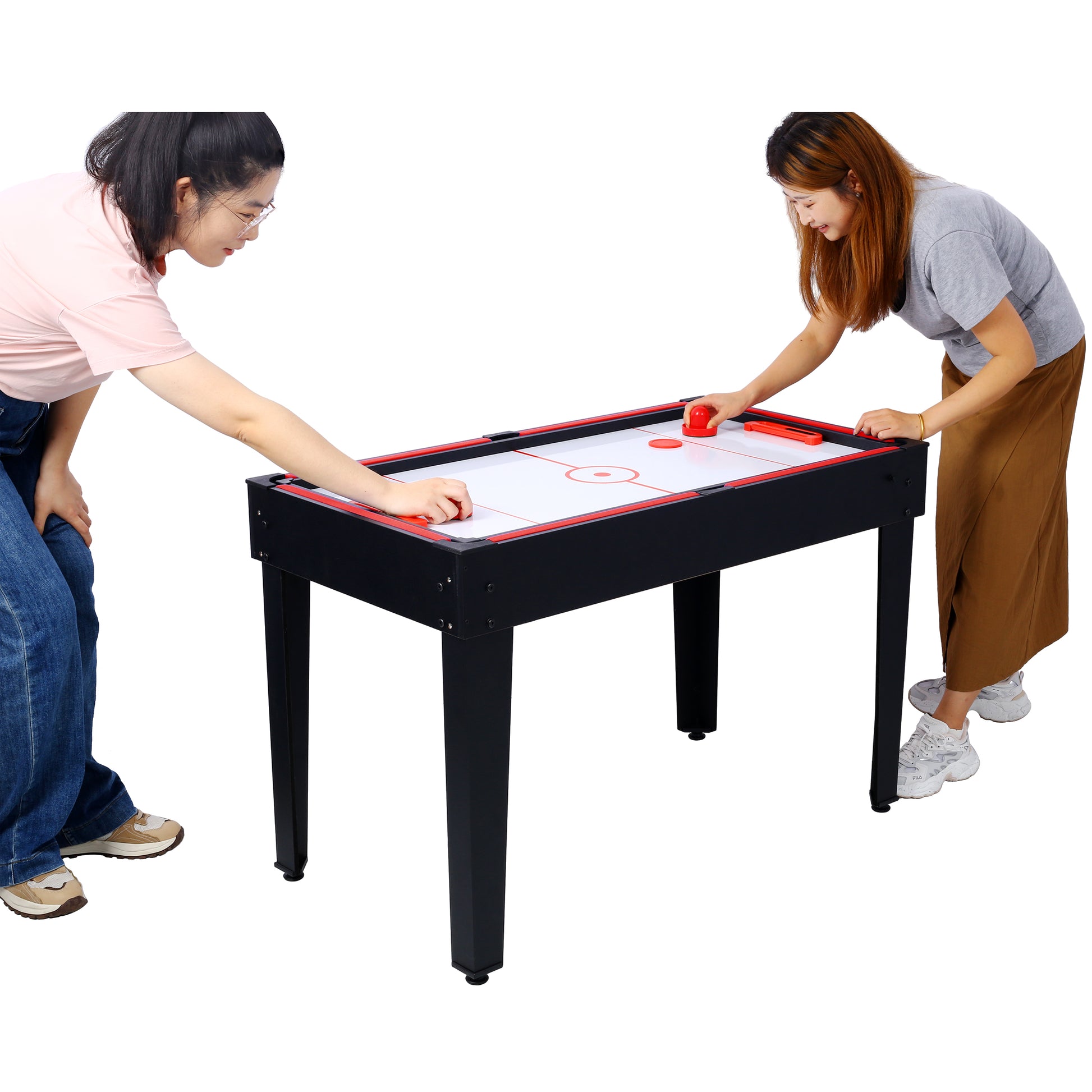 Black air hockey table with red trim featuring two people playing