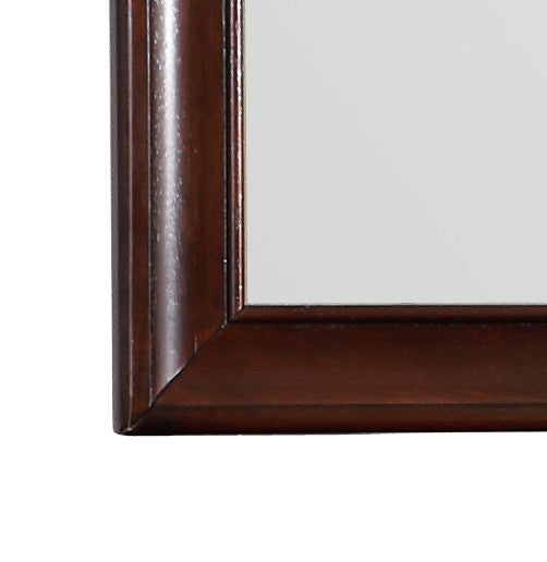 Closeup of ornate dark wood frame corner detail