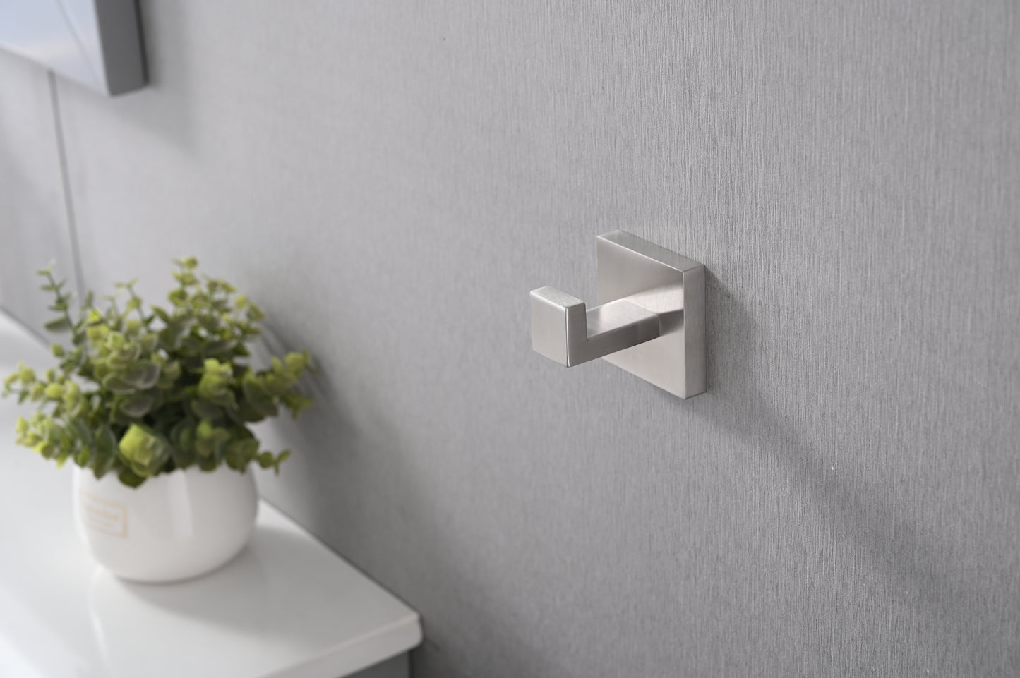 Modern brushed nickel wall hook for towels and coats