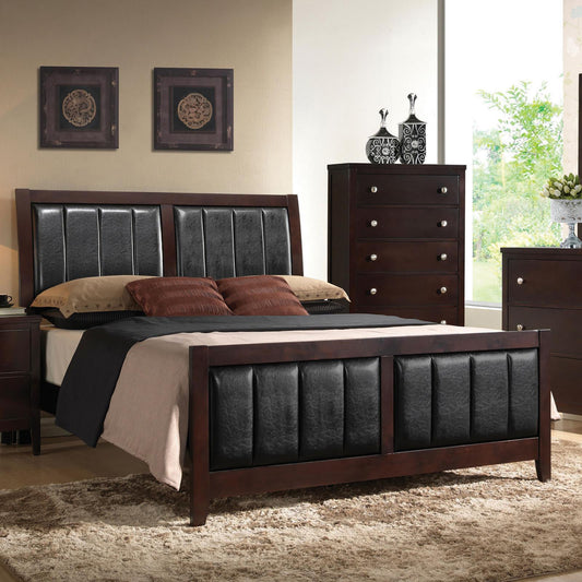 Dark wood platform bed with black faux leather headboard and footboard