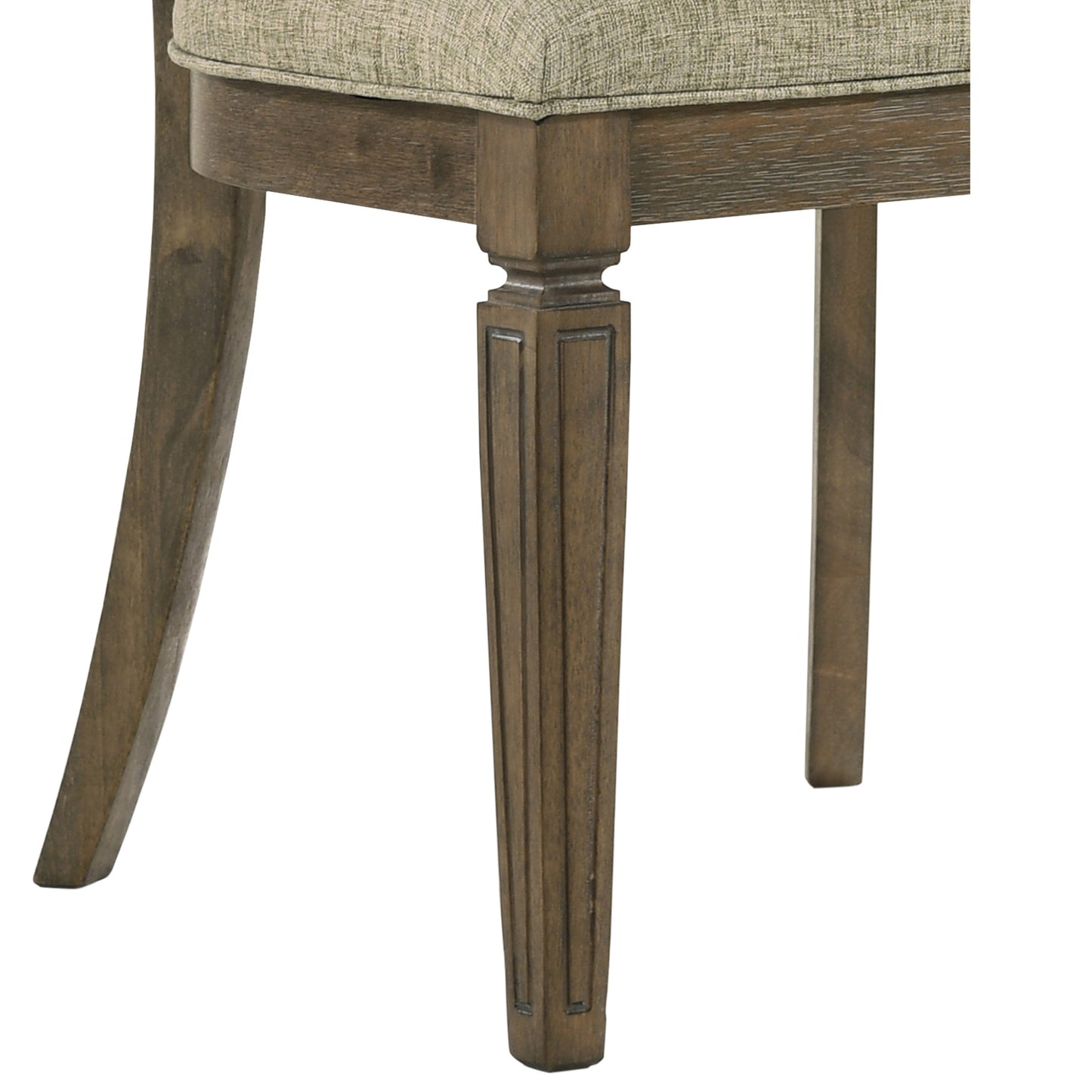 Closeup of a dark wood carved chair leg with a textured tan fabric seat