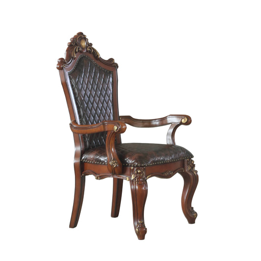 Ornate dark brown leather armchair with carved wood details and brass nailheads