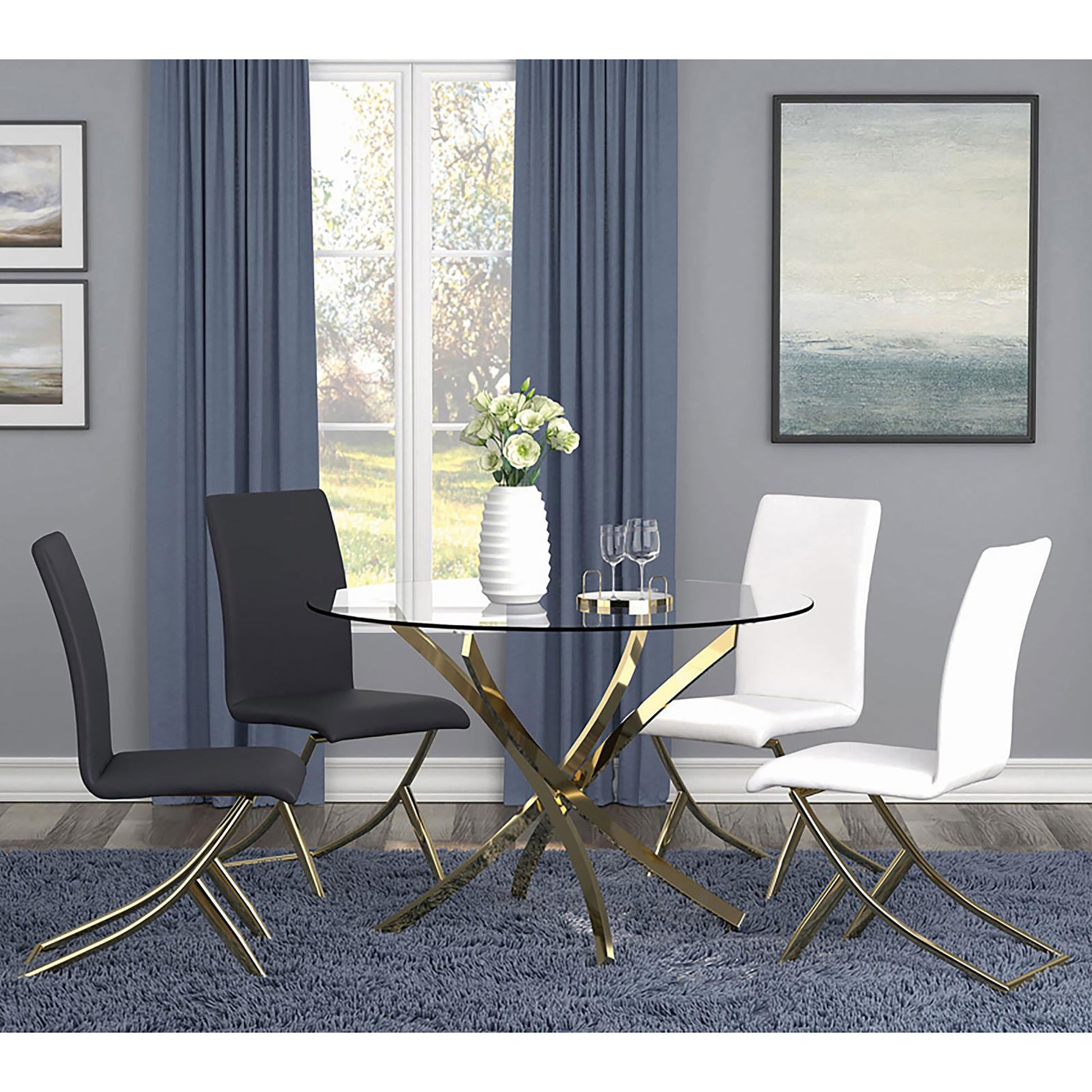 Round glass top dining table with gold pedestal base and four chairs