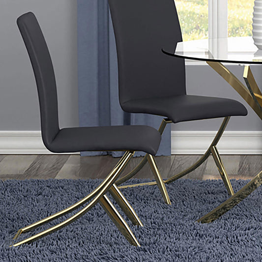 Dark gray faux leather dining chair with polished gold legs