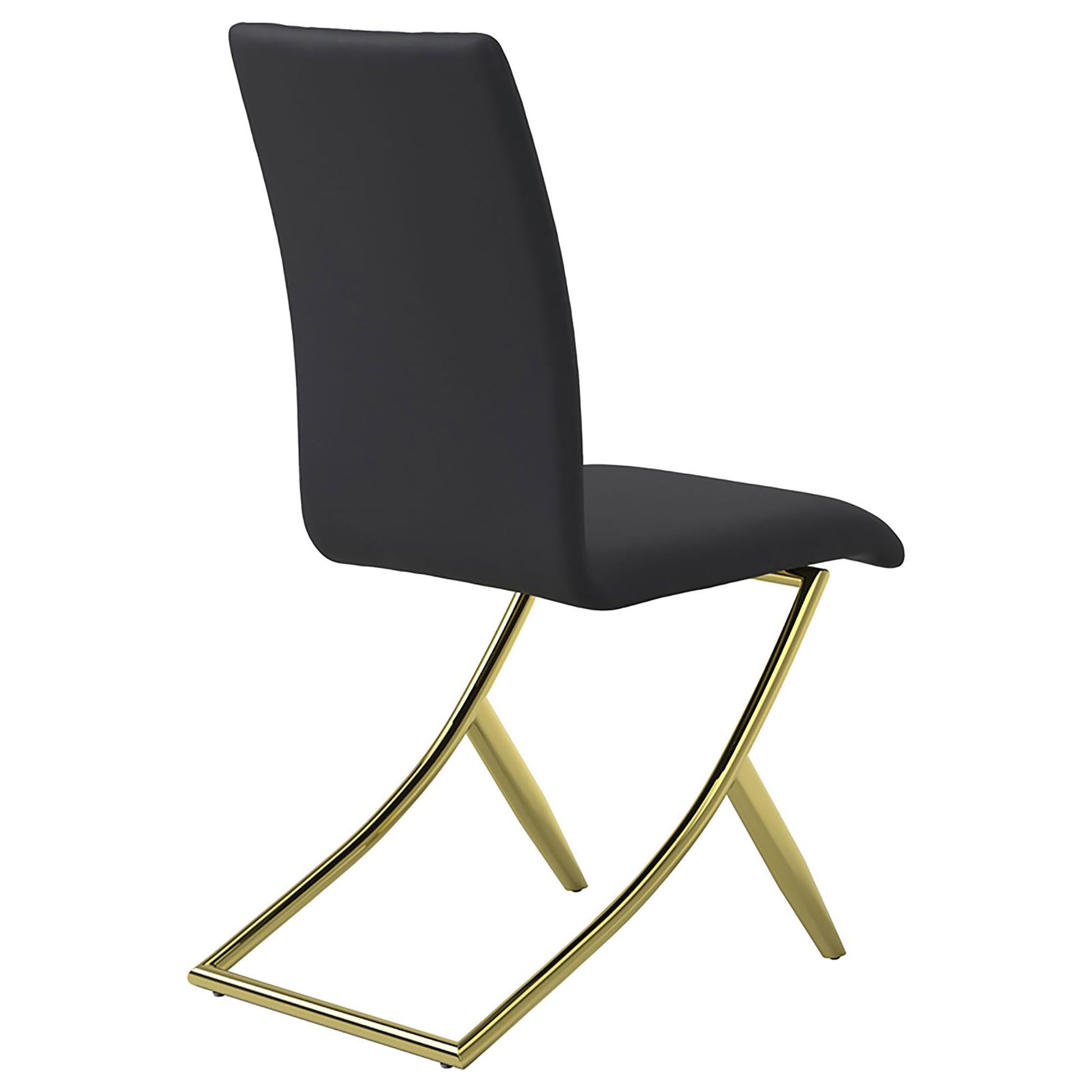 Black upholstered dining chair with polished gold metal legs and a unique crossbase design