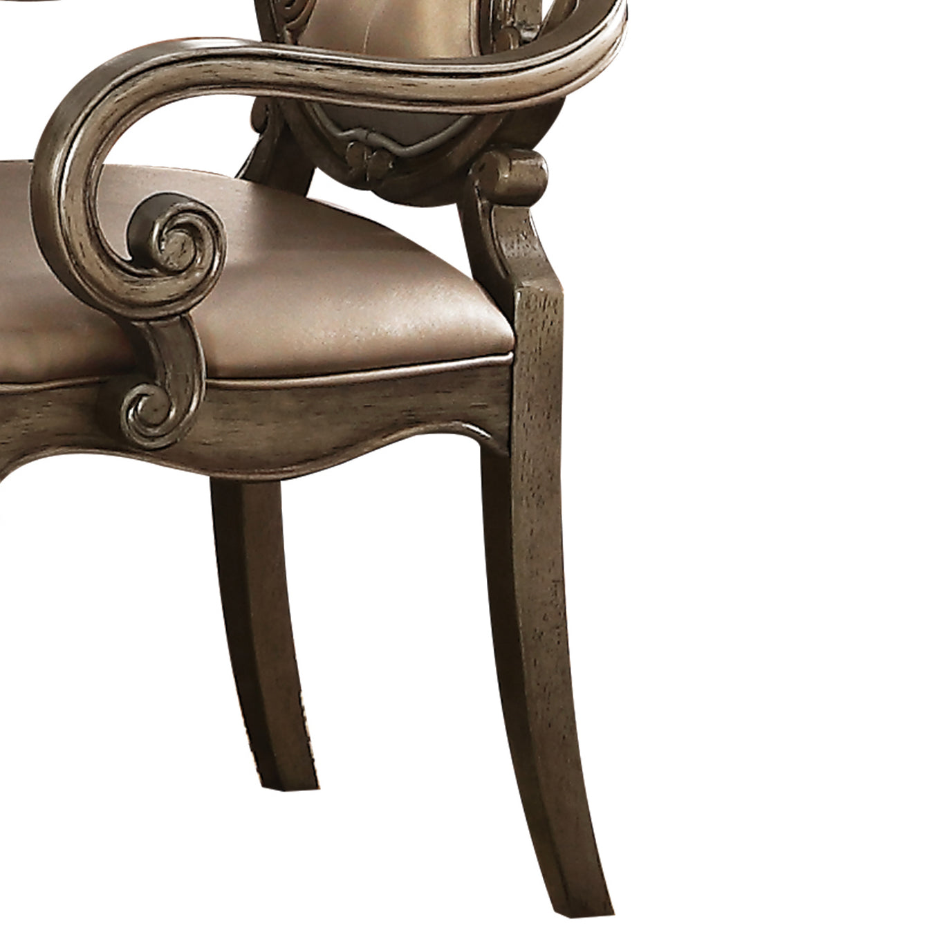 Ornate carved wooden armchair with upholstered seat in antique bronze finish
