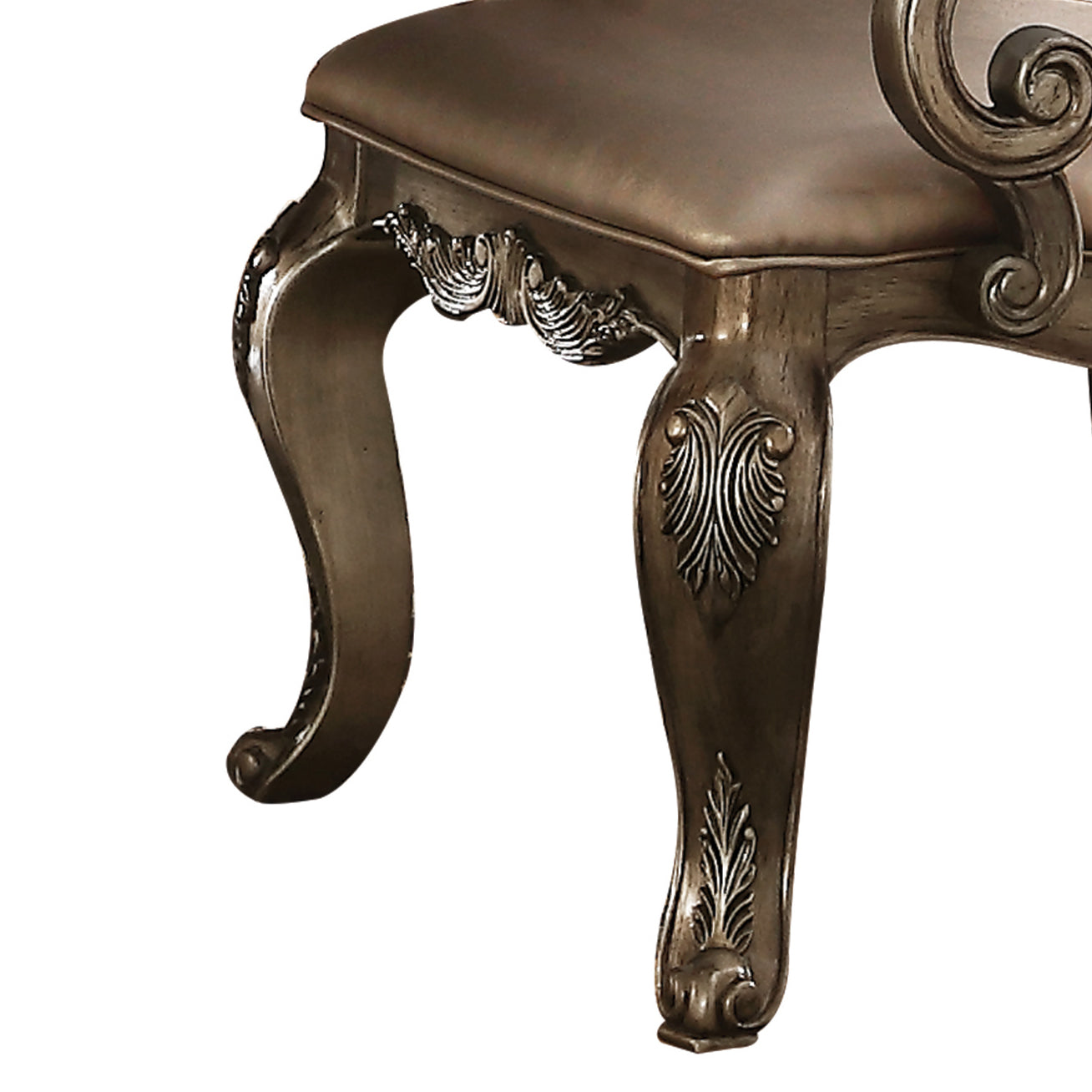 Ornate silver carved leg of a vintage armchair accentuating elegance