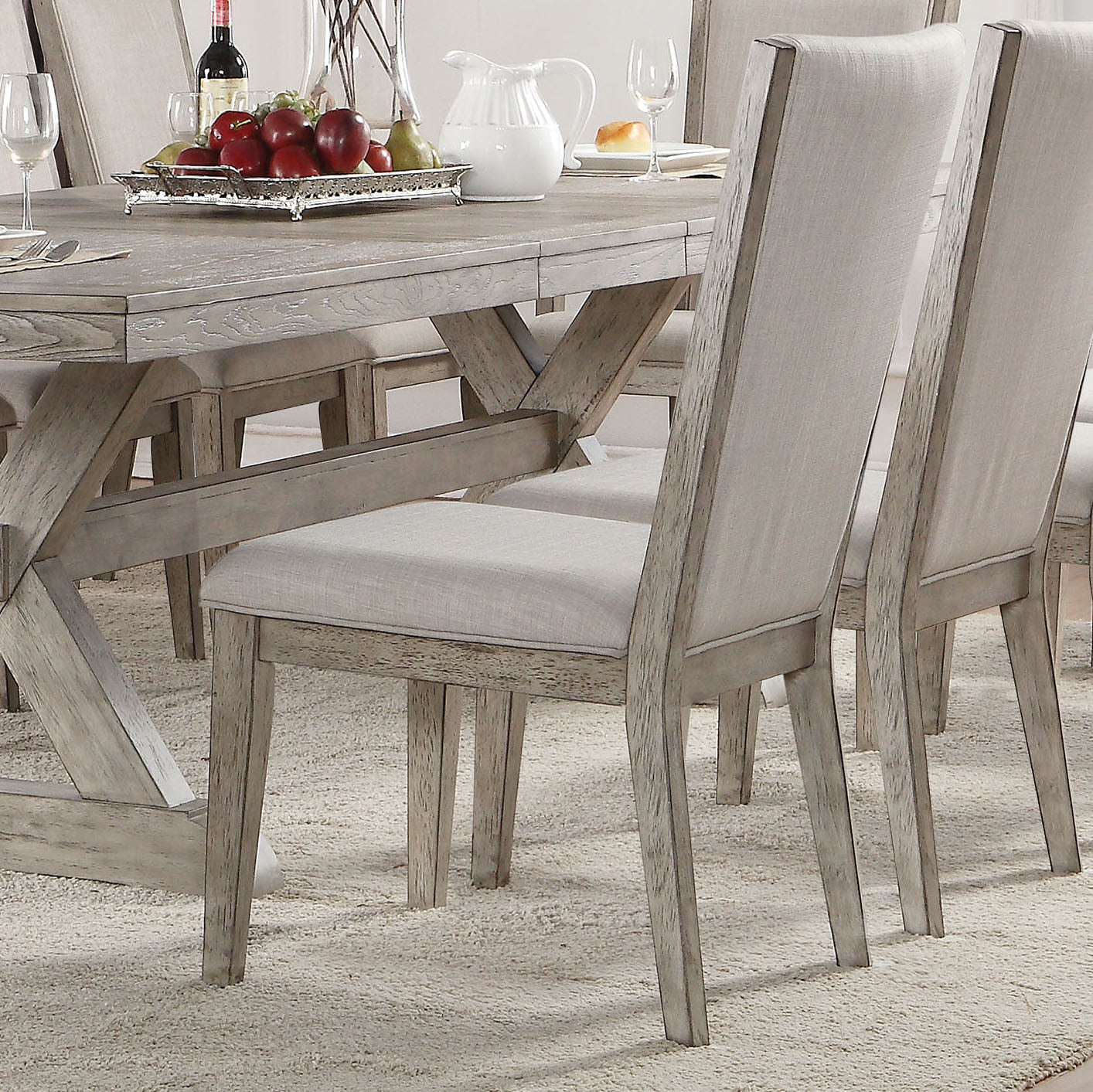 Rustic gray dining chair with upholstered light gray seat and back