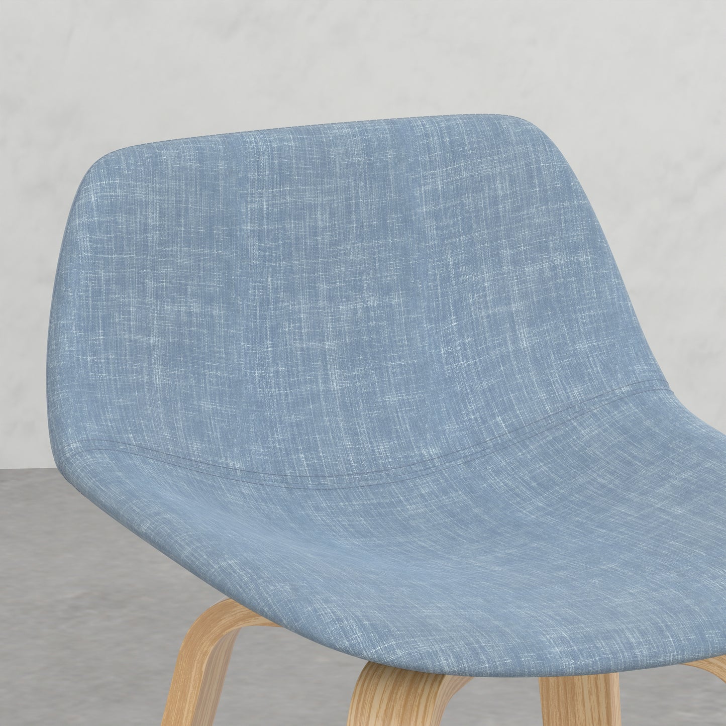 Light blue upholstered dining chair with curved wooden legs