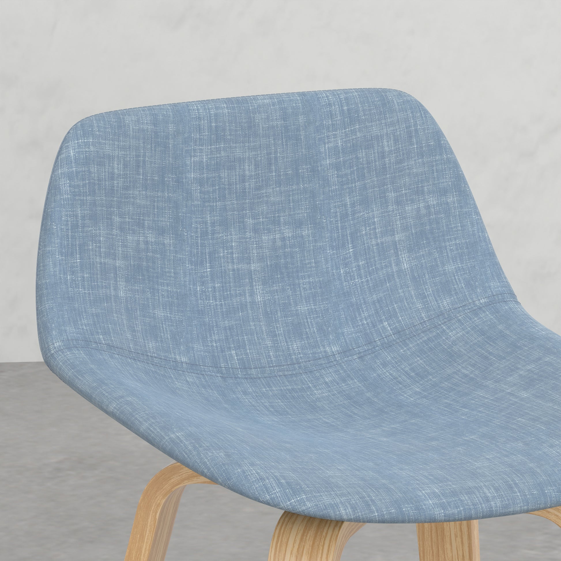 Light blue upholstered dining chair with curved wooden legs